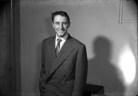 Smiling Young Man in Vintage Suit