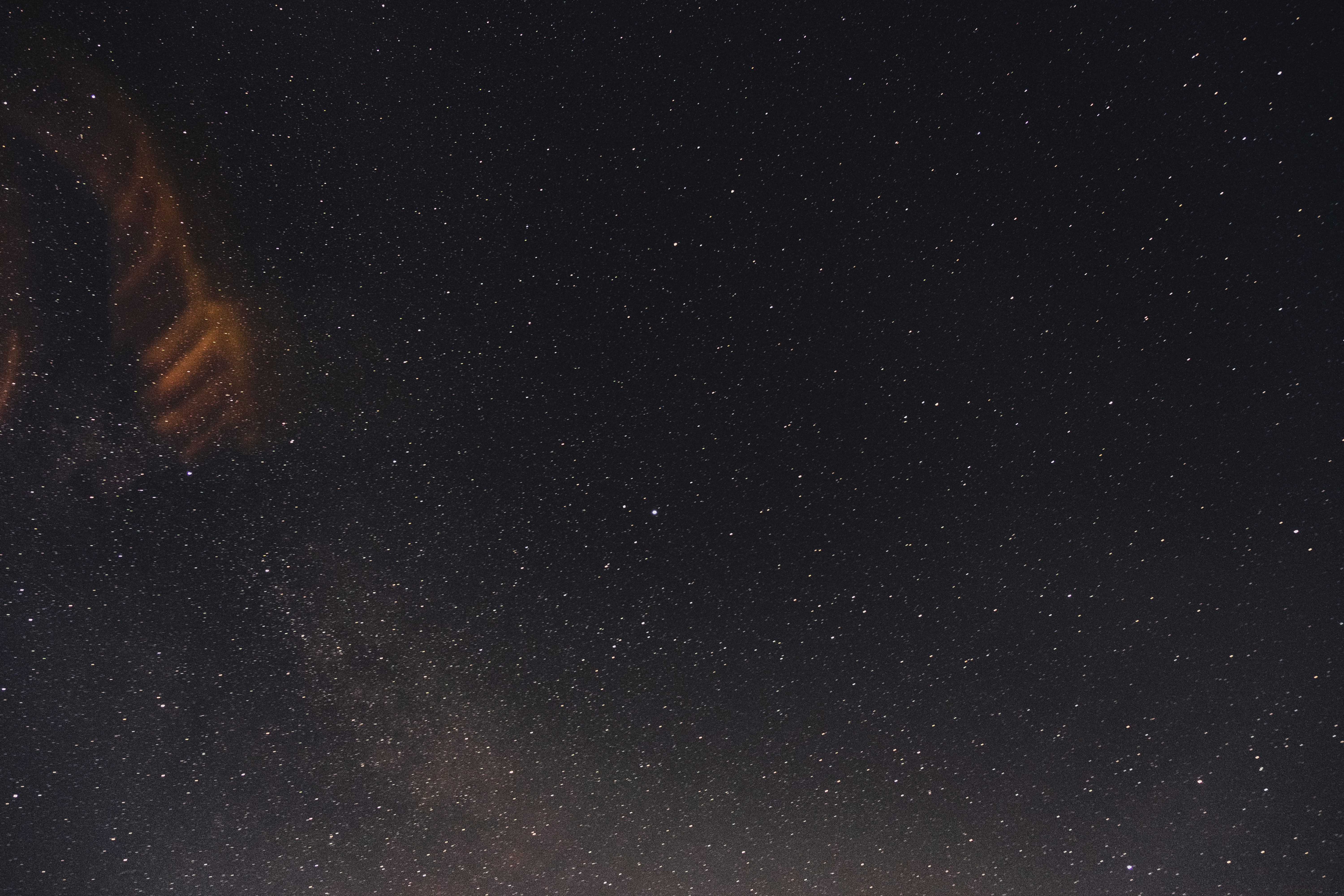 Starry Night Sky with Orange Cloud
