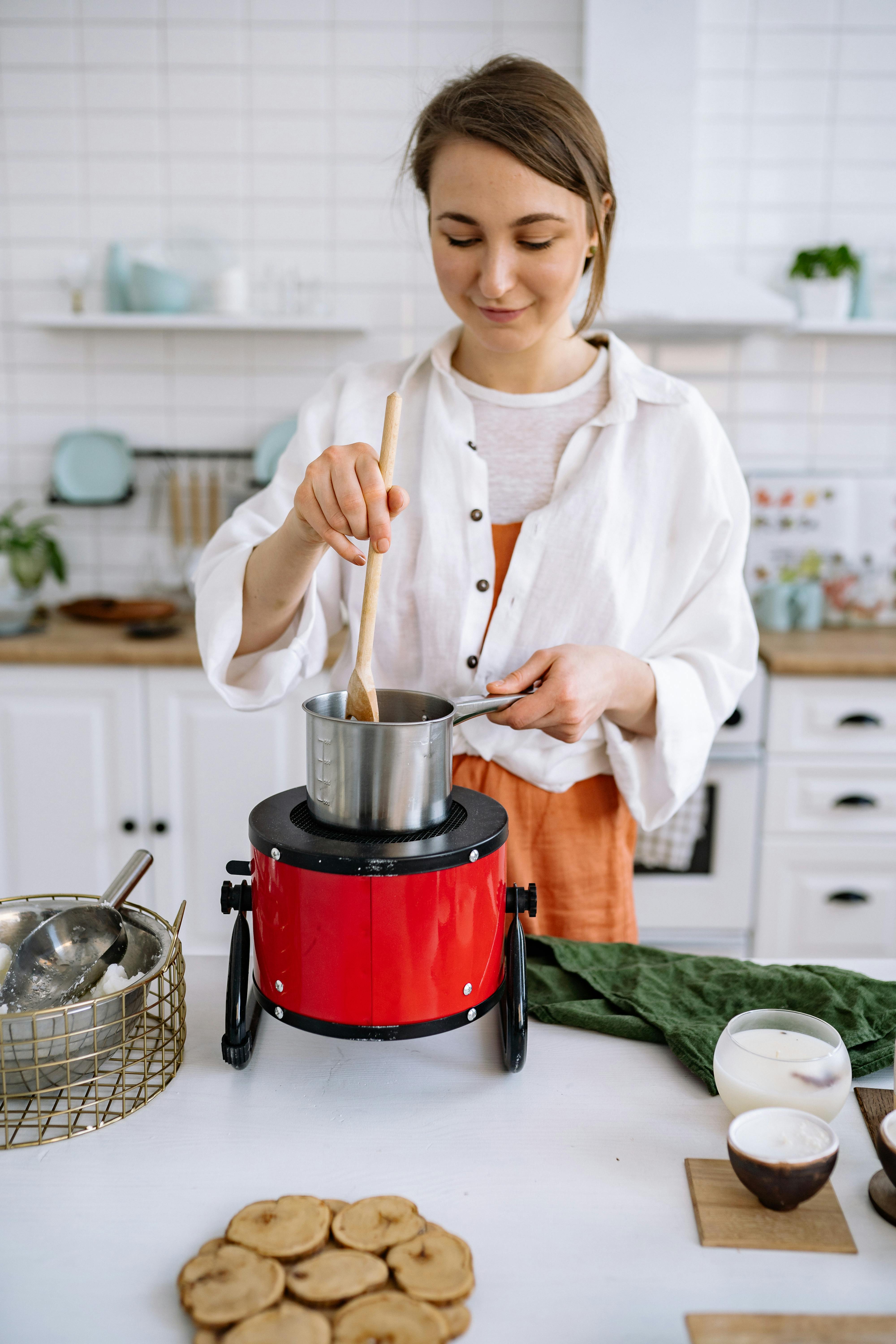 Woman Preparing Cheese Fondue