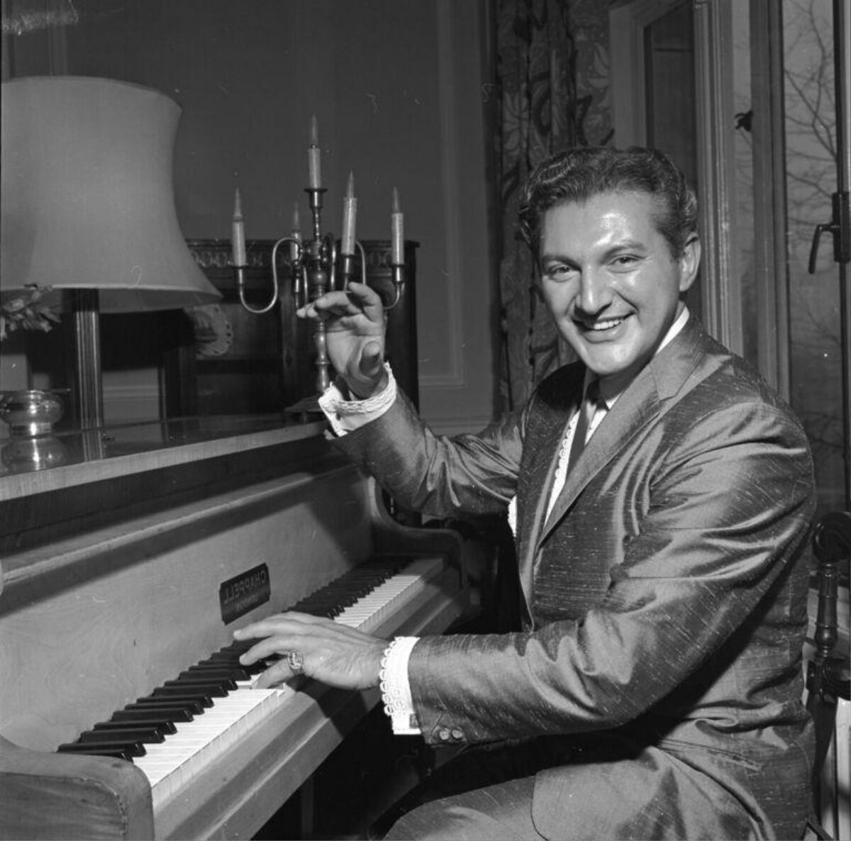 Smiling Man Sitting at Piano