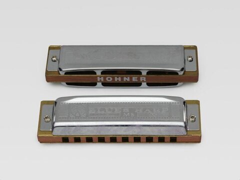 Two Hohner Blues Harp Harmonicas