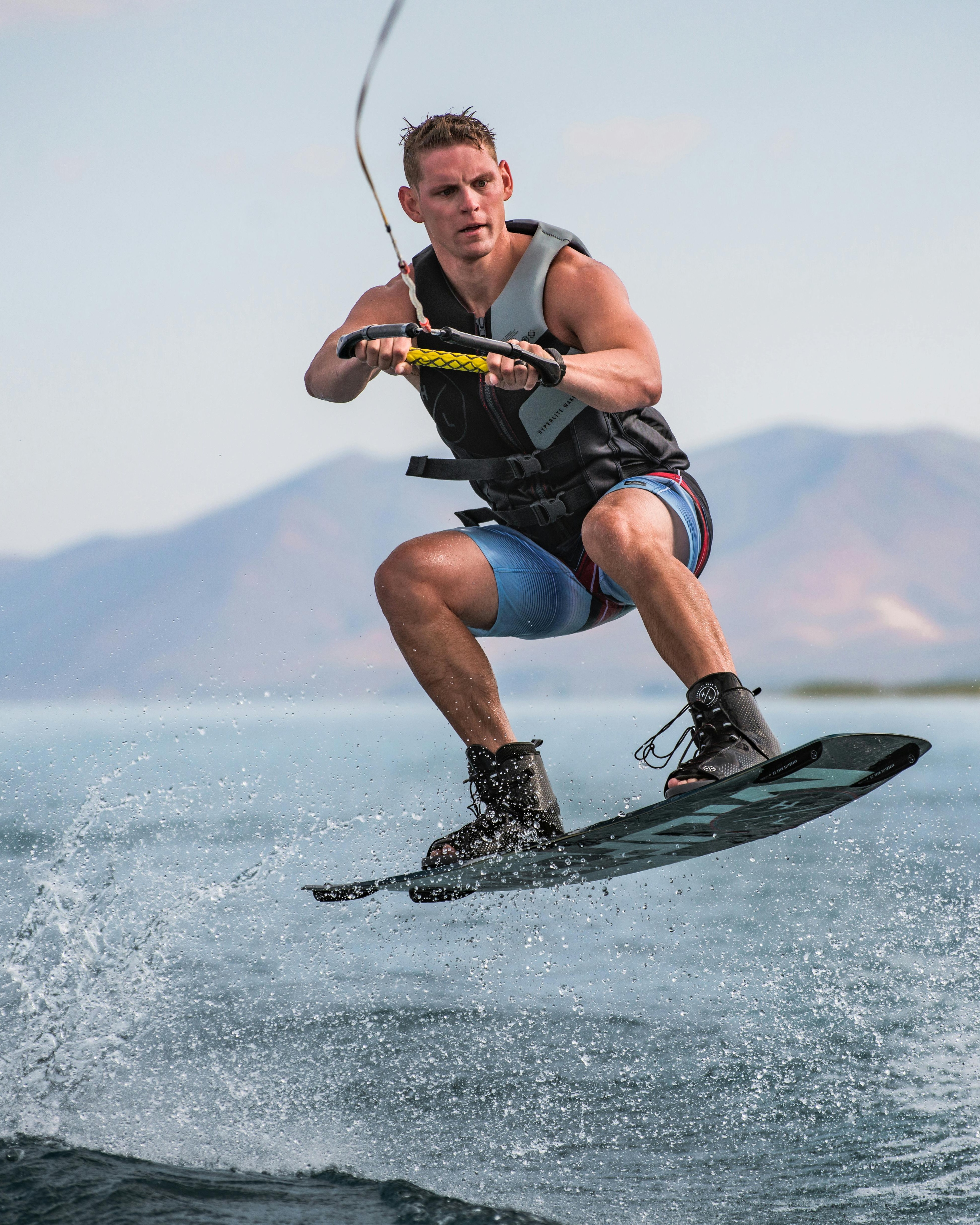 Man Wakeboarding on Open Lake