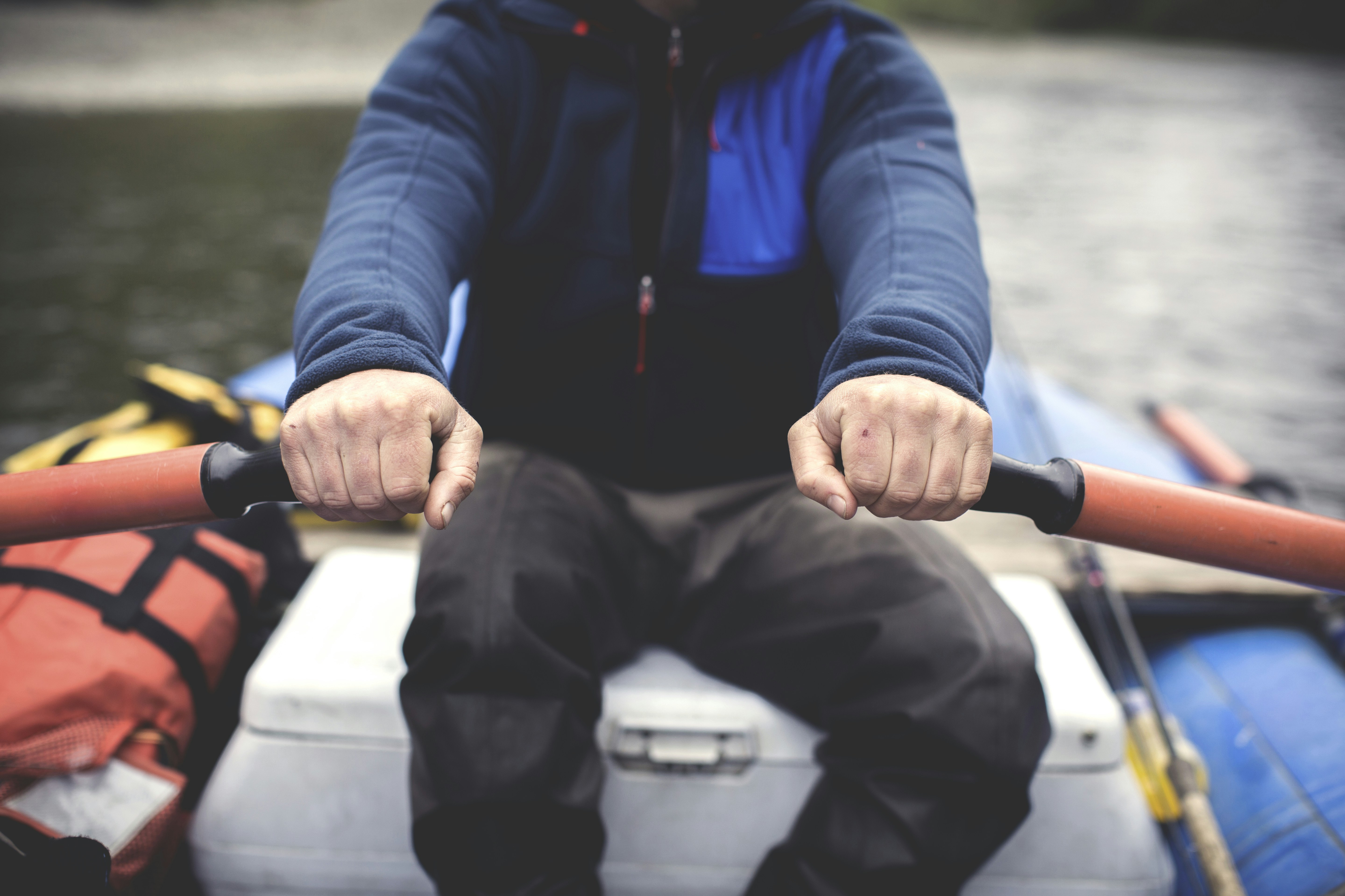 Person Rowing Boat on Calm Water