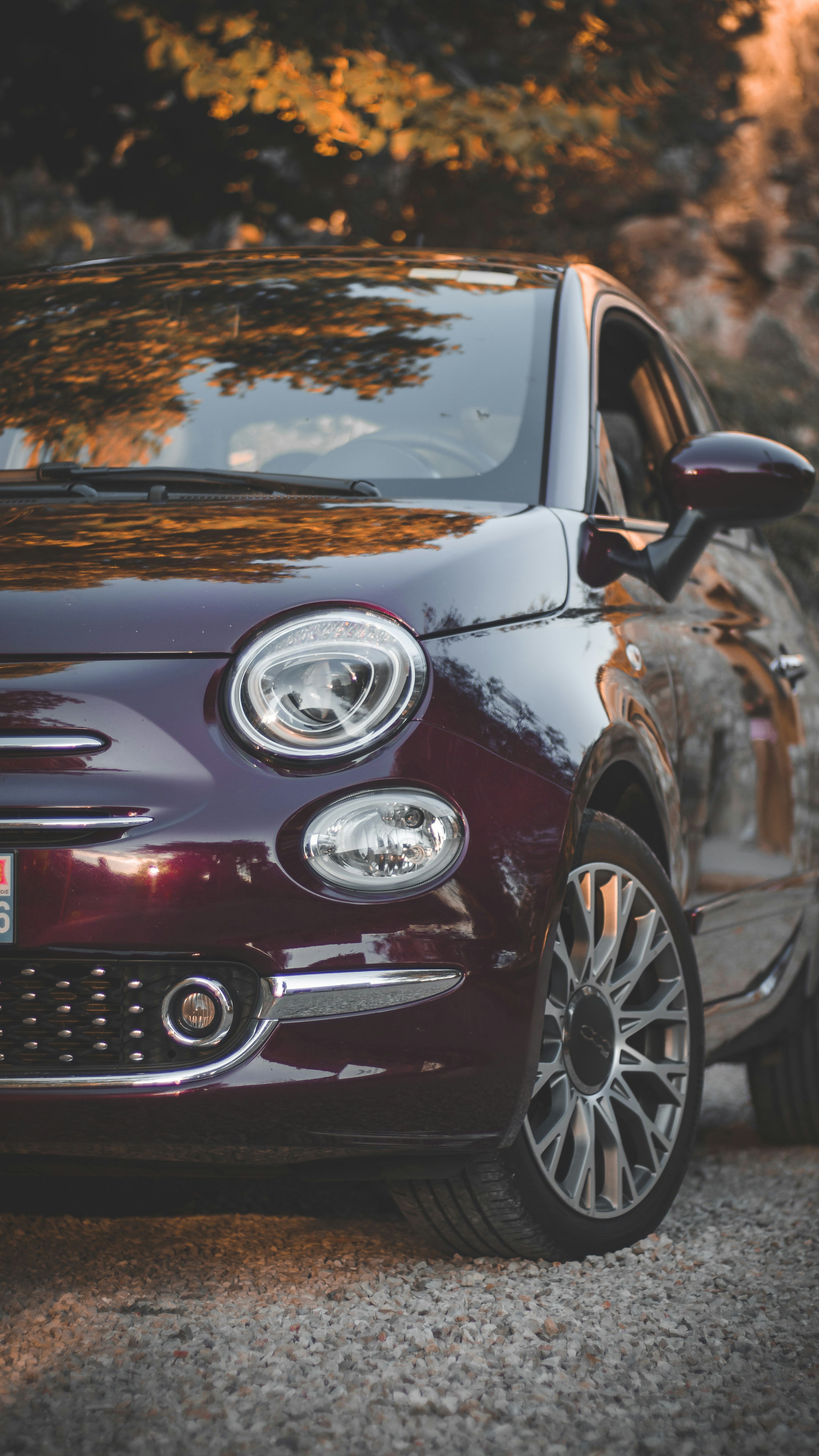 Maroon Fiat 500 at Sunset