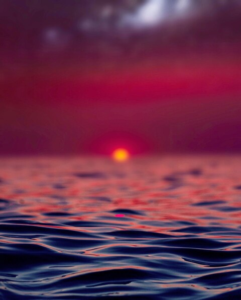 Crimson Sunset Over the Sea