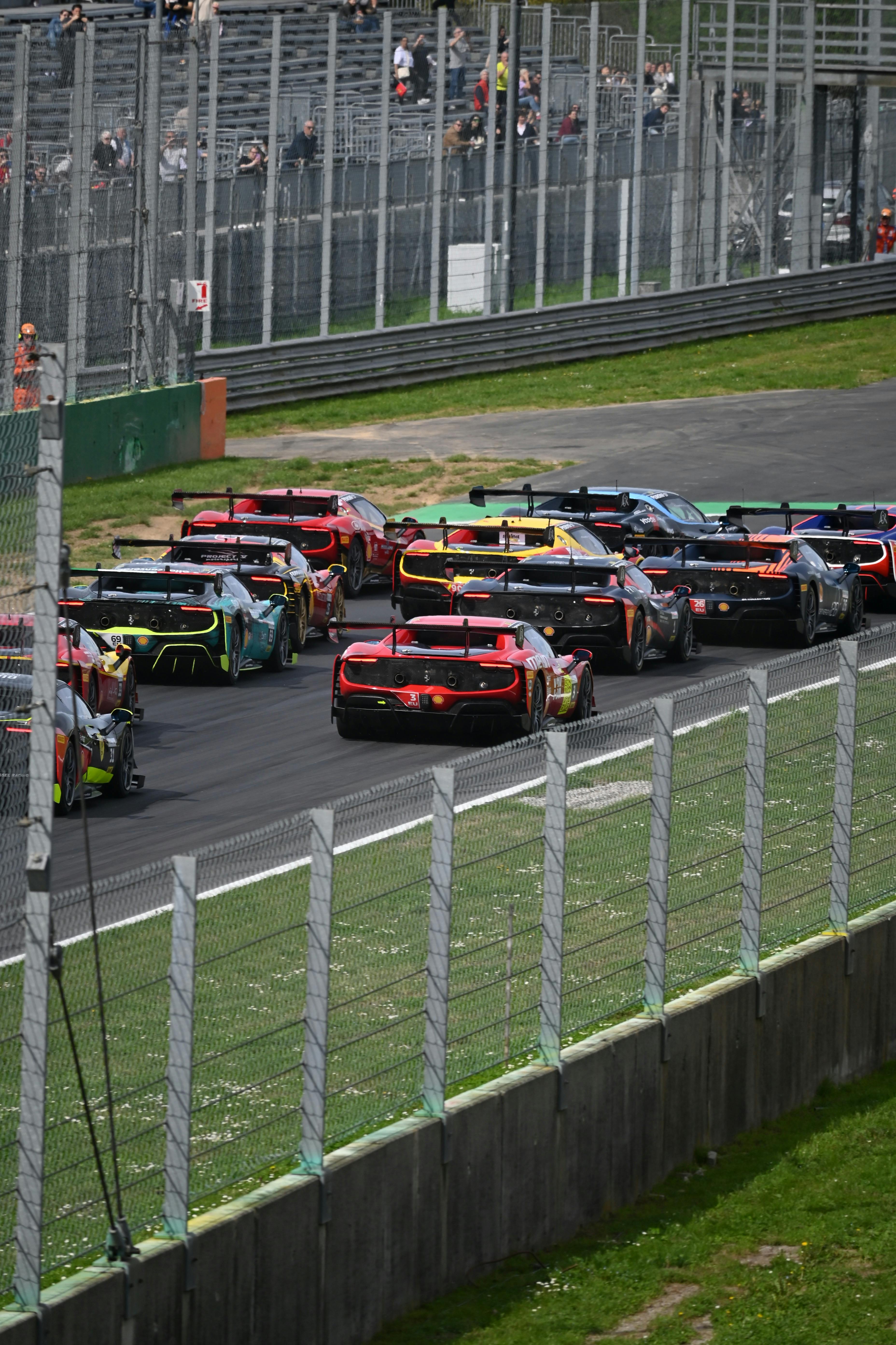 Race Cars Competing on Race Track