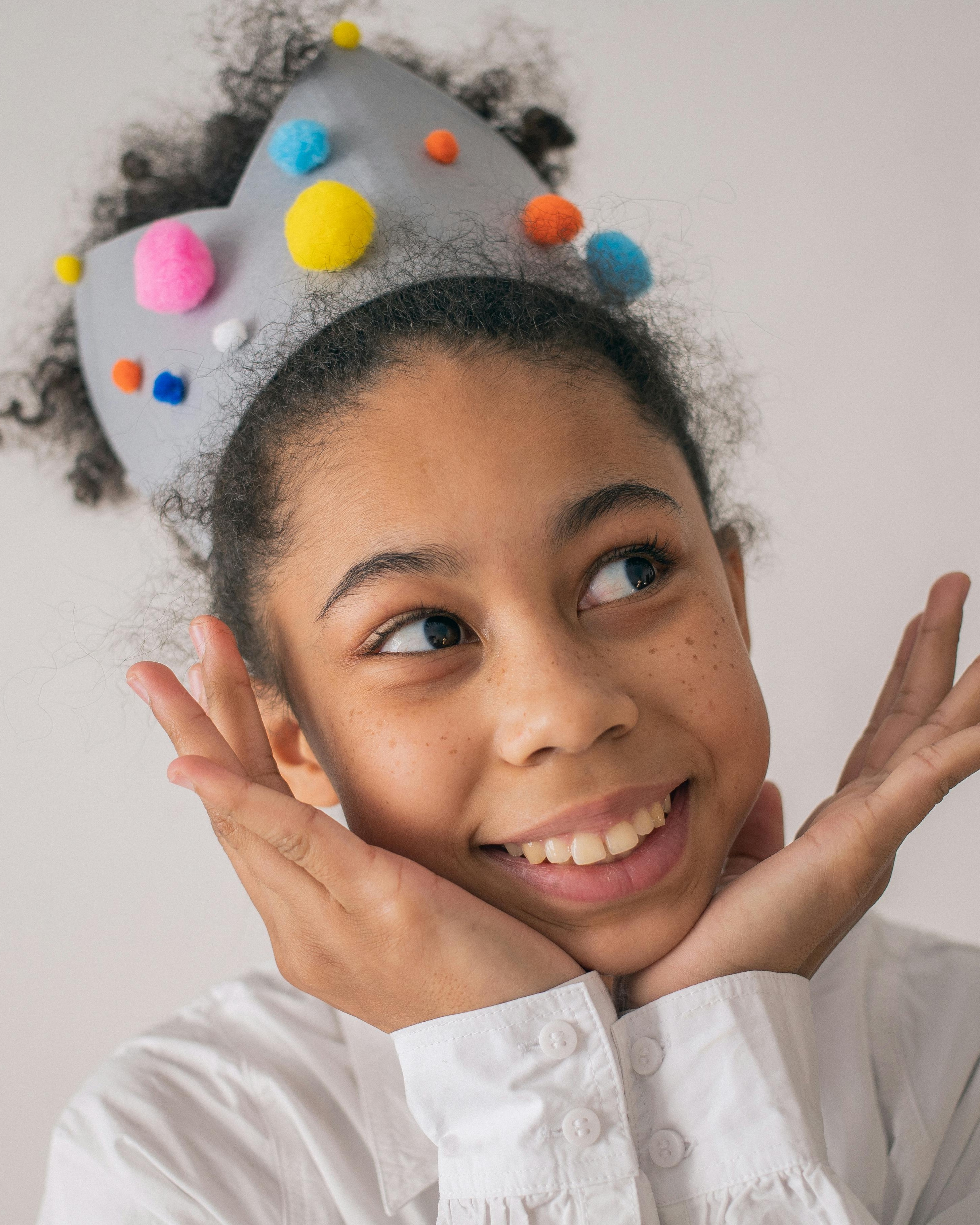 Smiling Girl with Handmade Party Crown