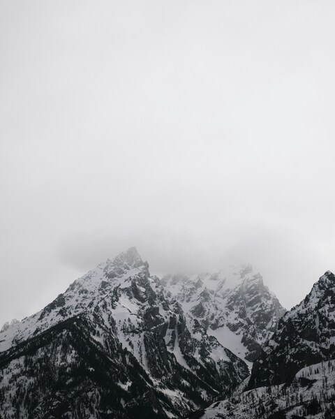 Foggy Snow-capped Mountain Range
