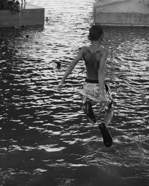 Boy Jumping Into Water