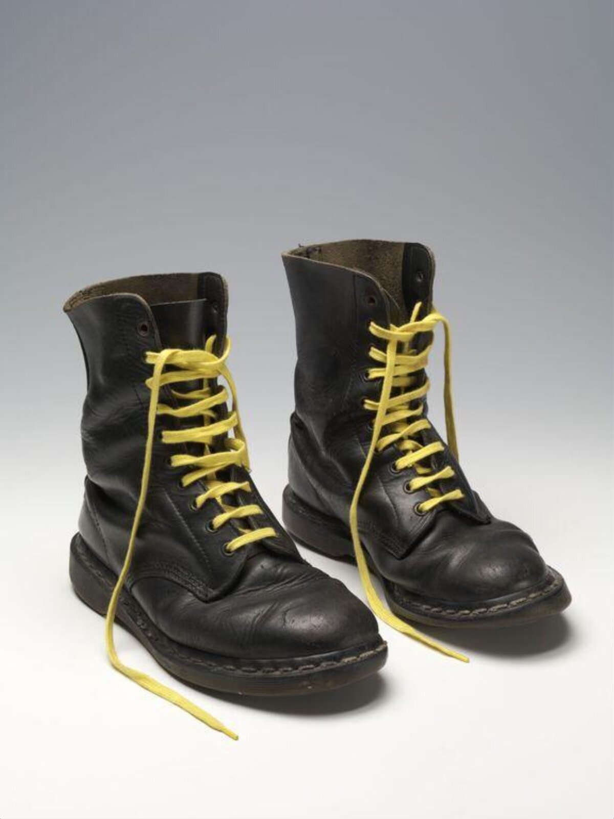 Pair of Black Leather Boots with Yellow Laces — Business
