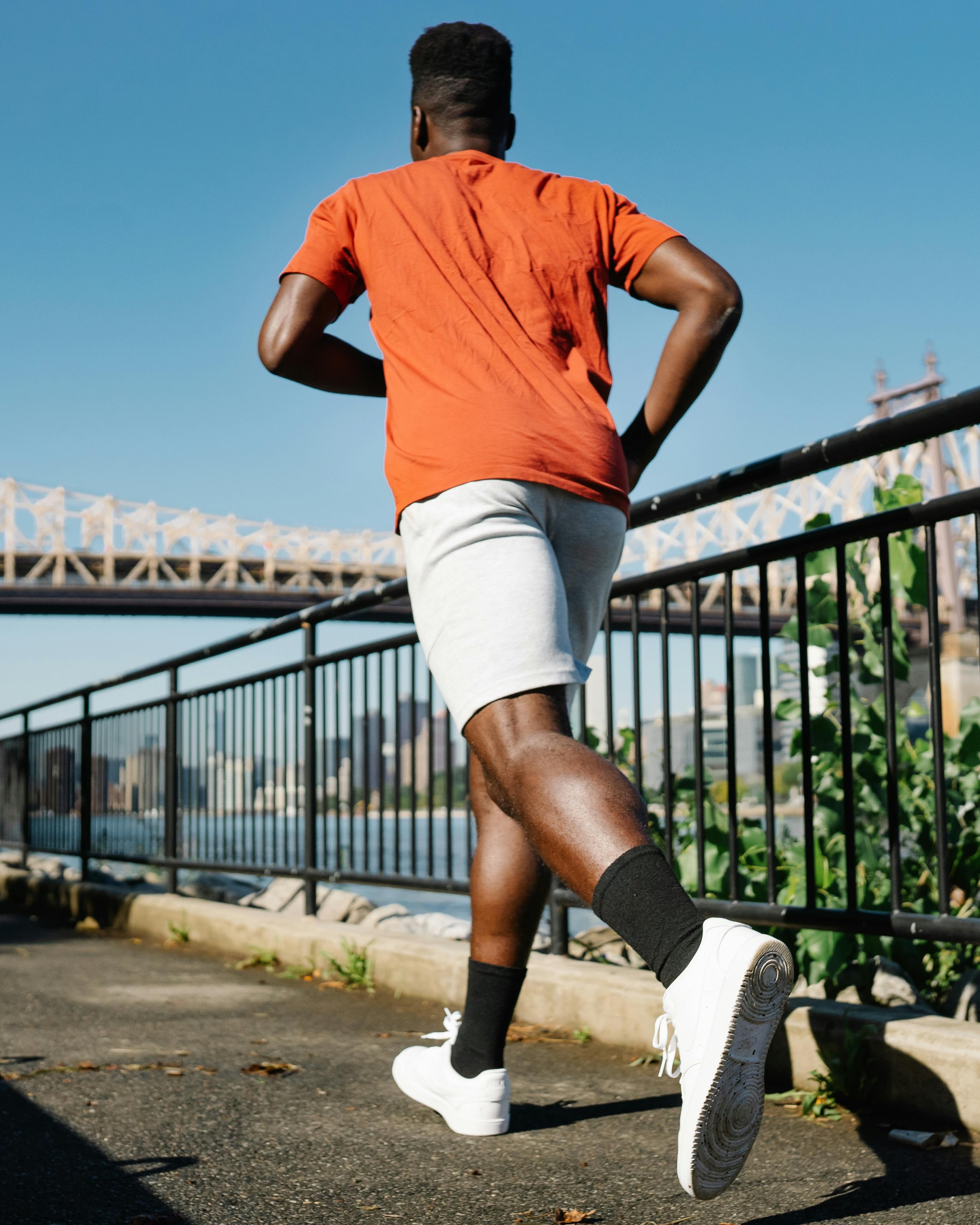 Man Jogging Along Riverside Path