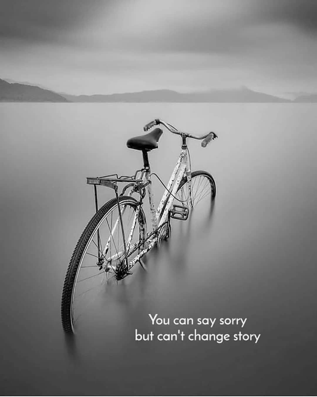 Bicycle Submerged in Calm Water