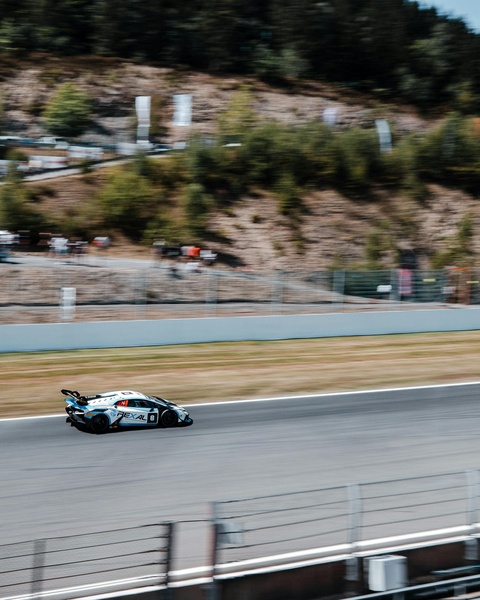 Race Car Speeding on Race Track