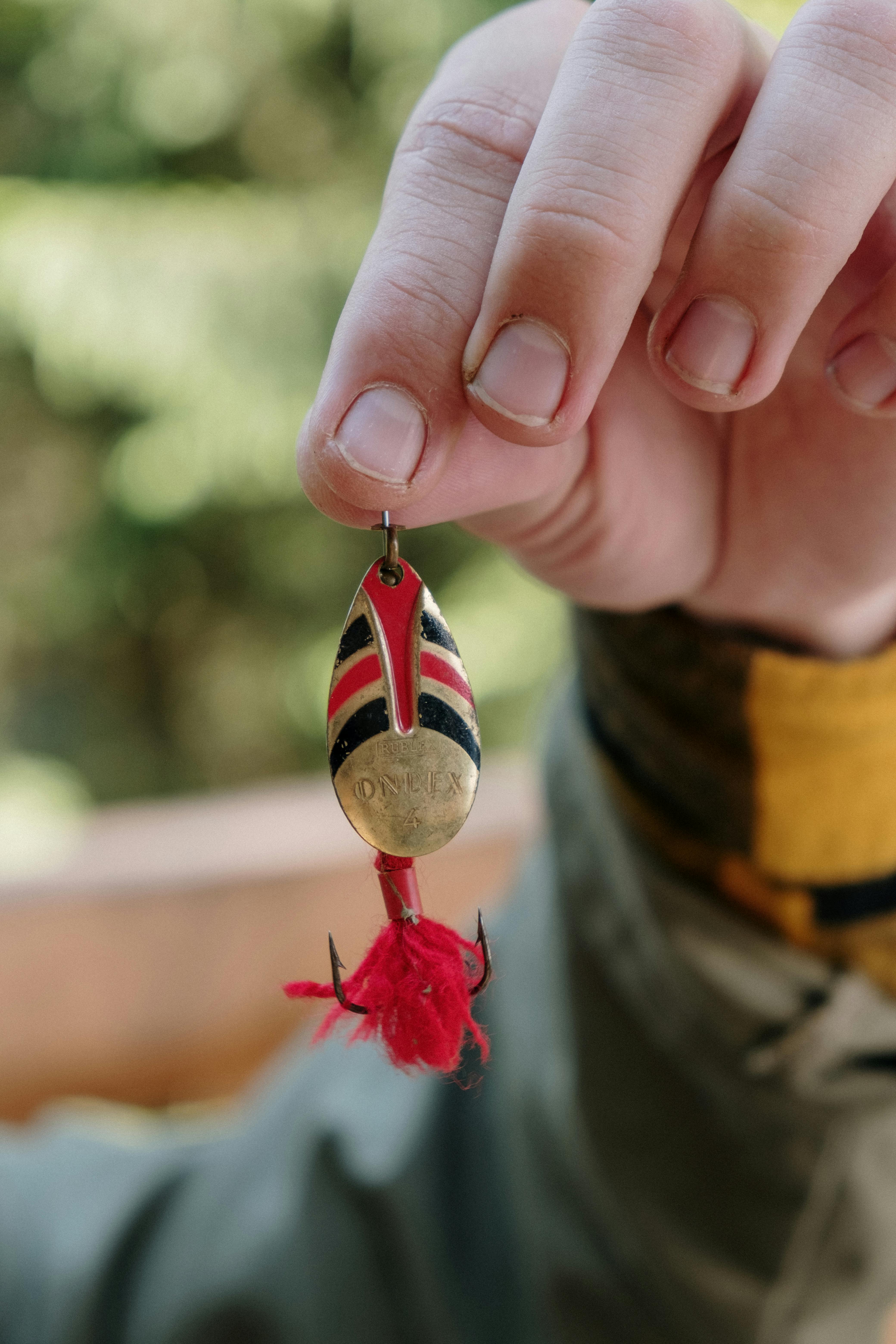 Hand Holding Vintage Fishing Lure