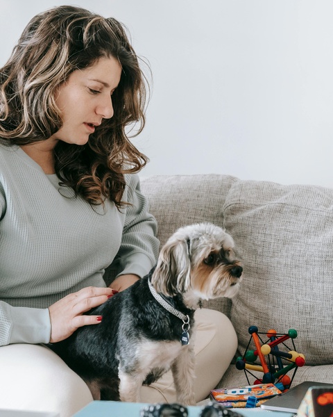 Woman With Pet Dog on Couch