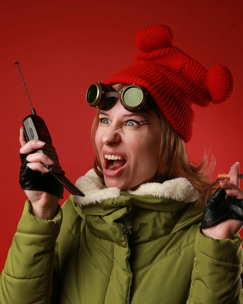 Quirky Woman Holding Vintage Cellphone