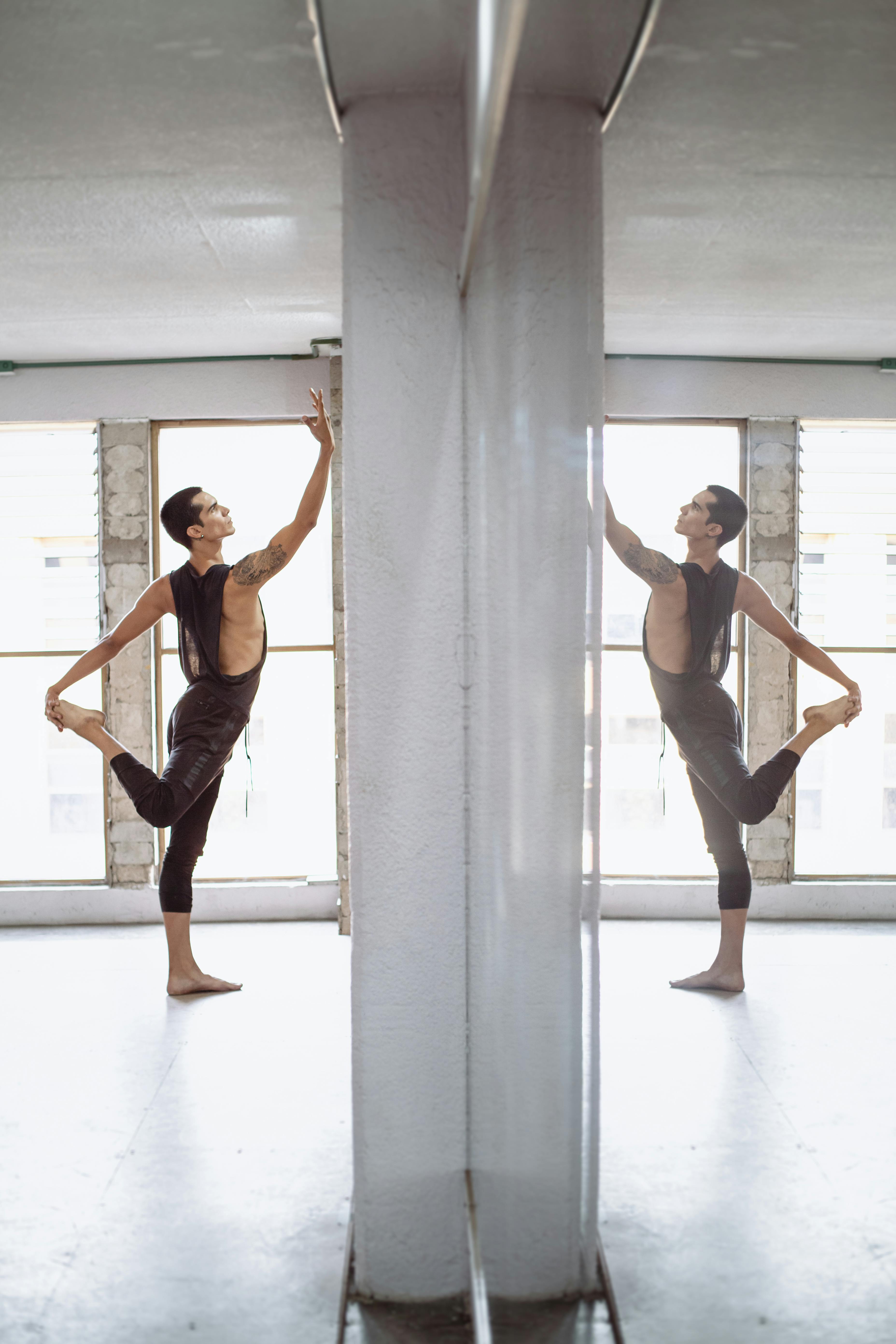 Male Dancer Stretching in Dance Studio