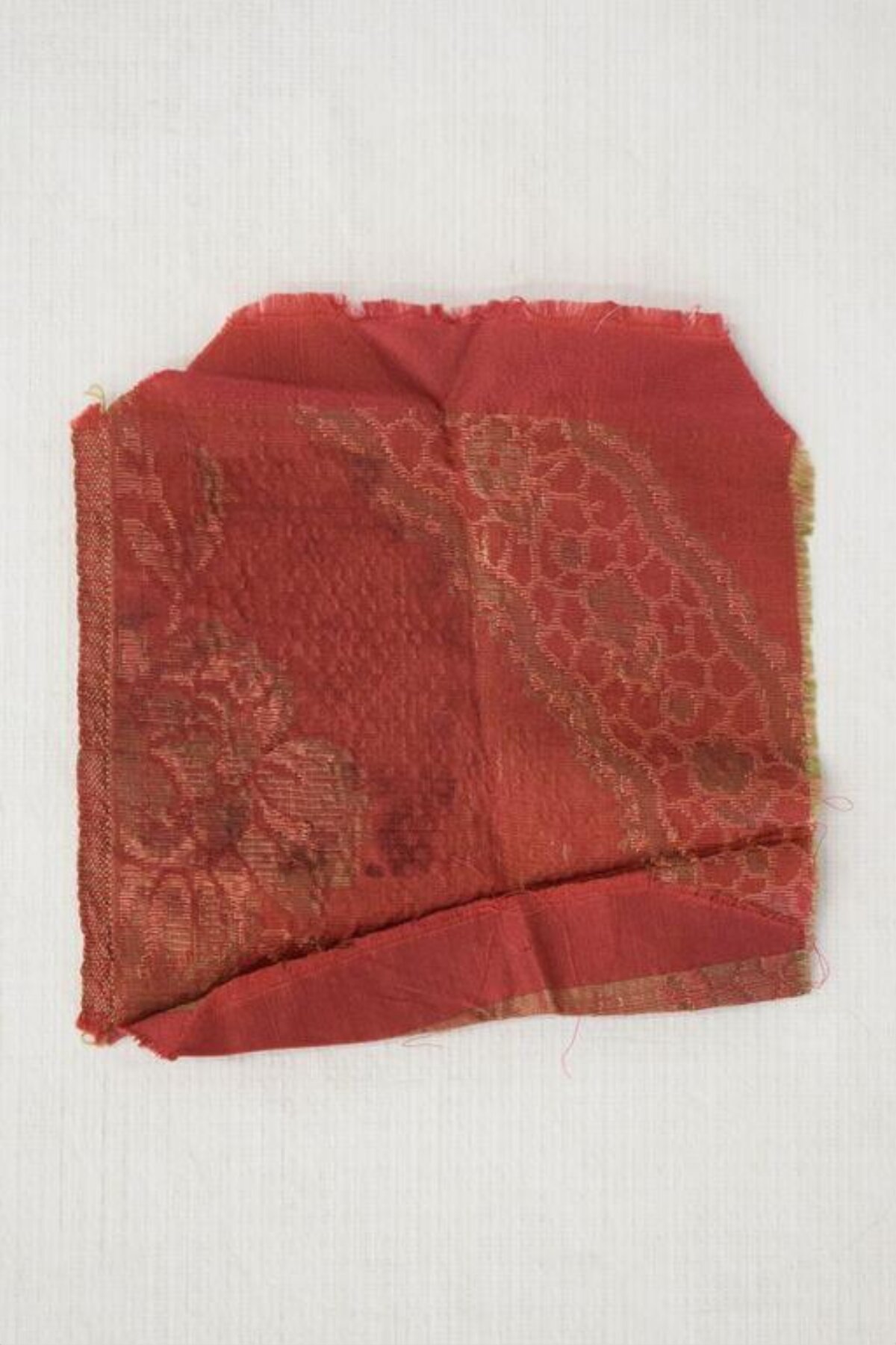 Red Antique Patterned Fabric Fragment