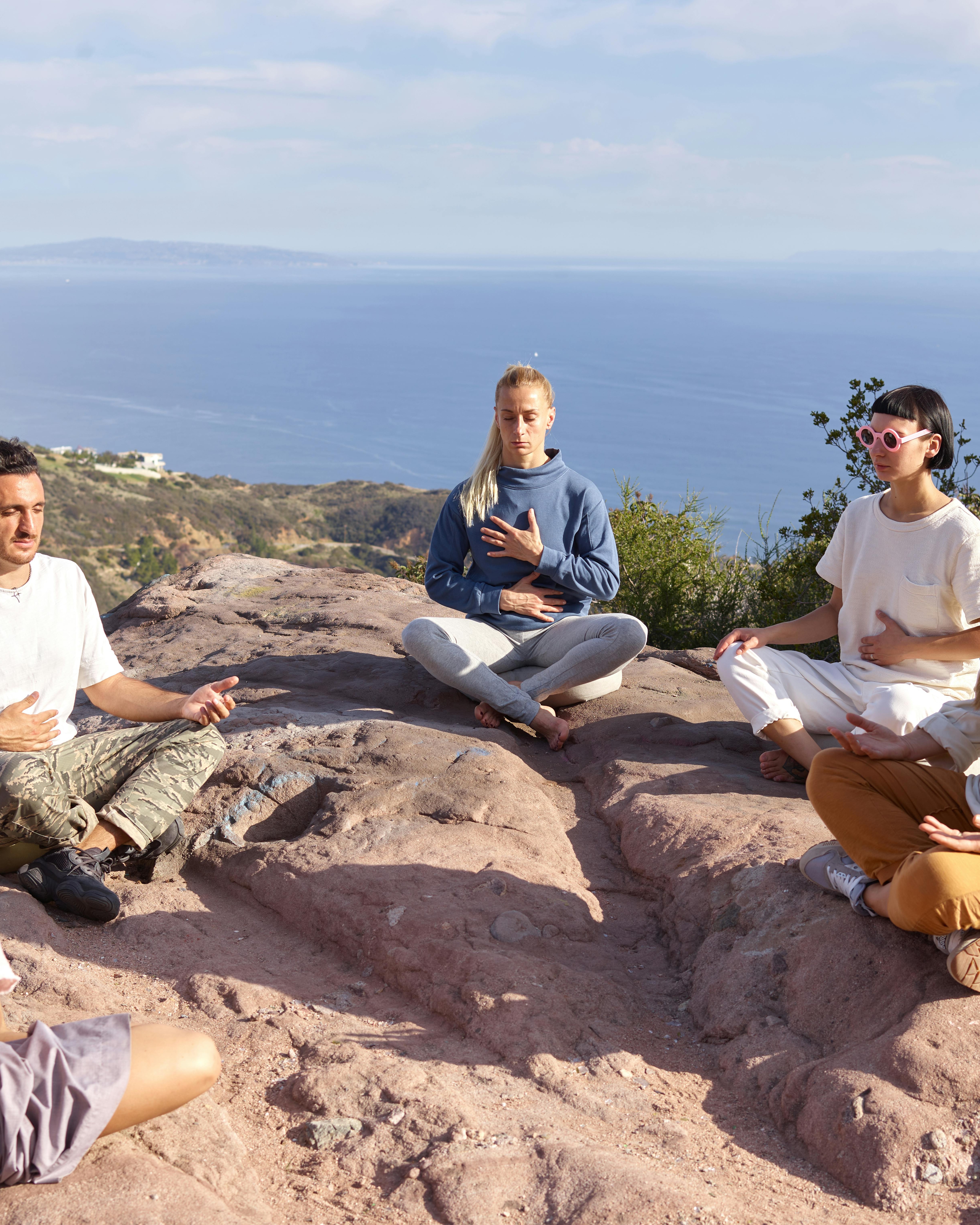 Group Outdoor Meditation Overlooking Ocean