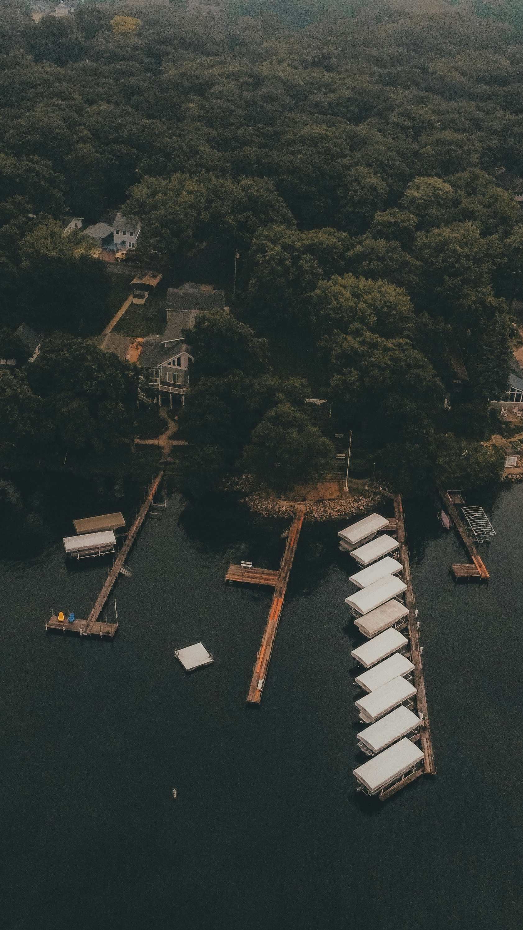 Aerial View of Lakeside Boat Docks and Cabins