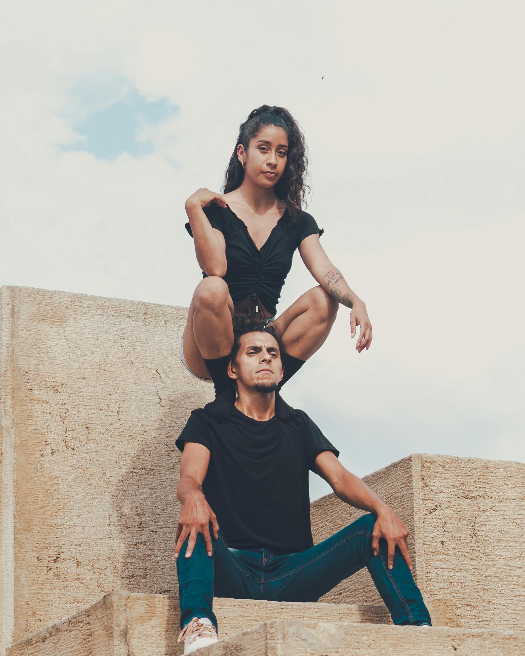Two People Posing On Stone Steps