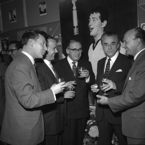 Group of Men Toasting in Recording Studio