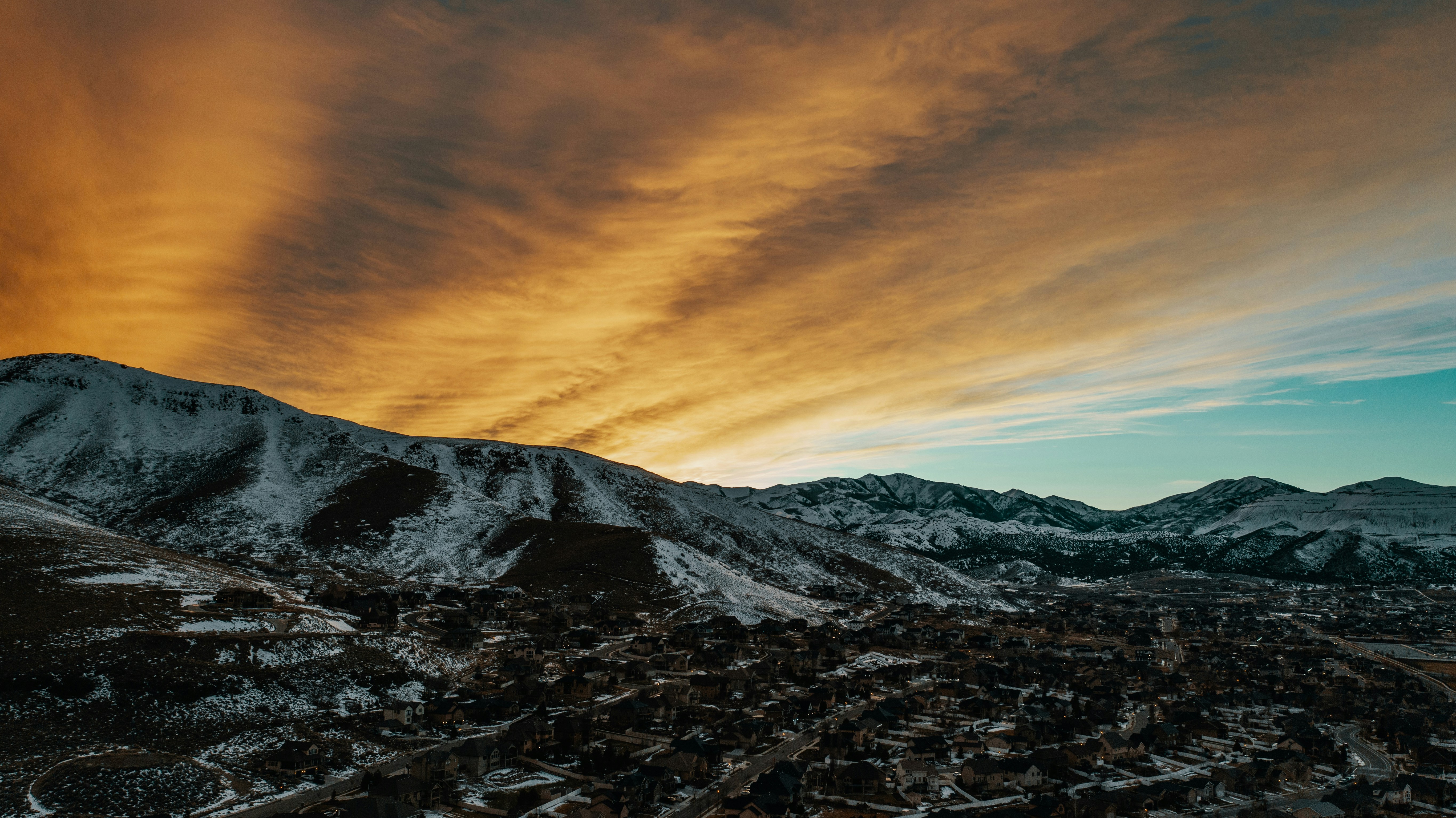 Sunset Over Snowy Mountain Town