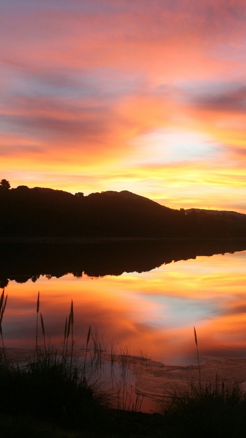 Sunset Reflection on Calm Lake