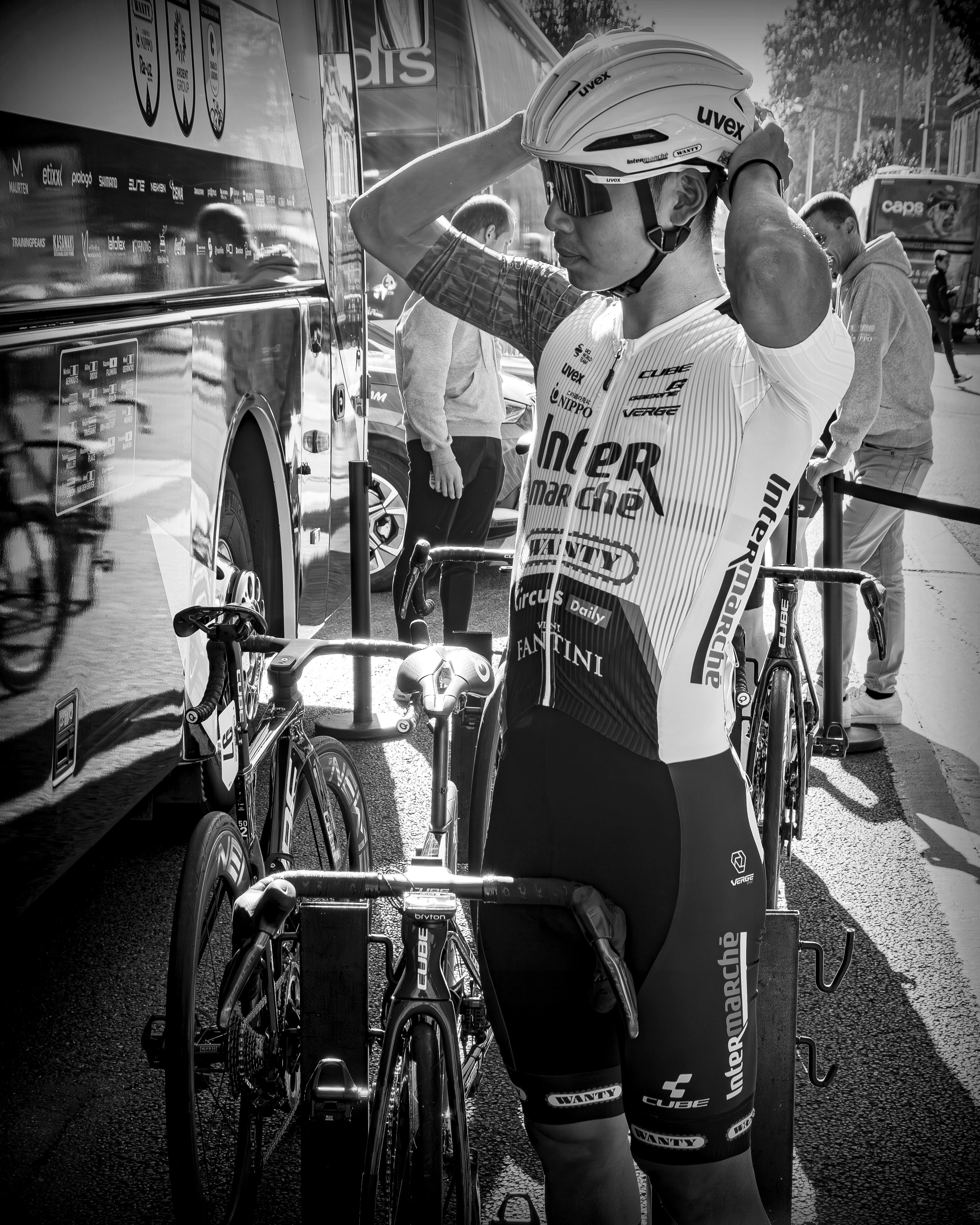 Pro Cyclist Adjusting Helmet Before Race