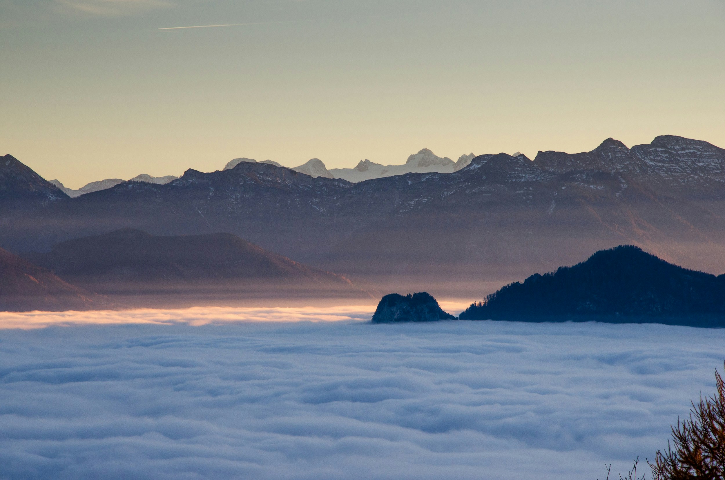 Mountain Peaks Above Sea of Clouds