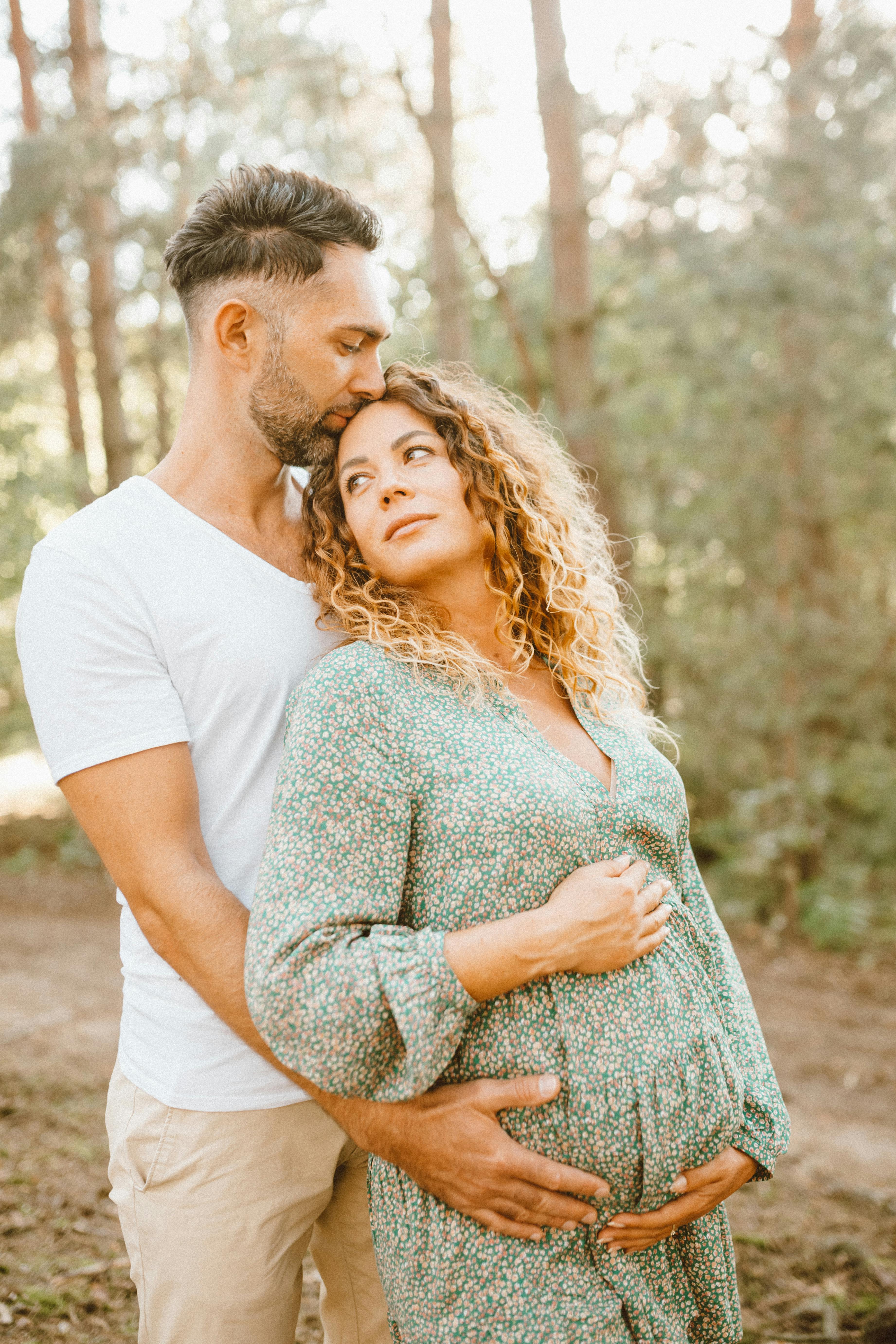 Expecting Couple in Forest Maternity Portrait