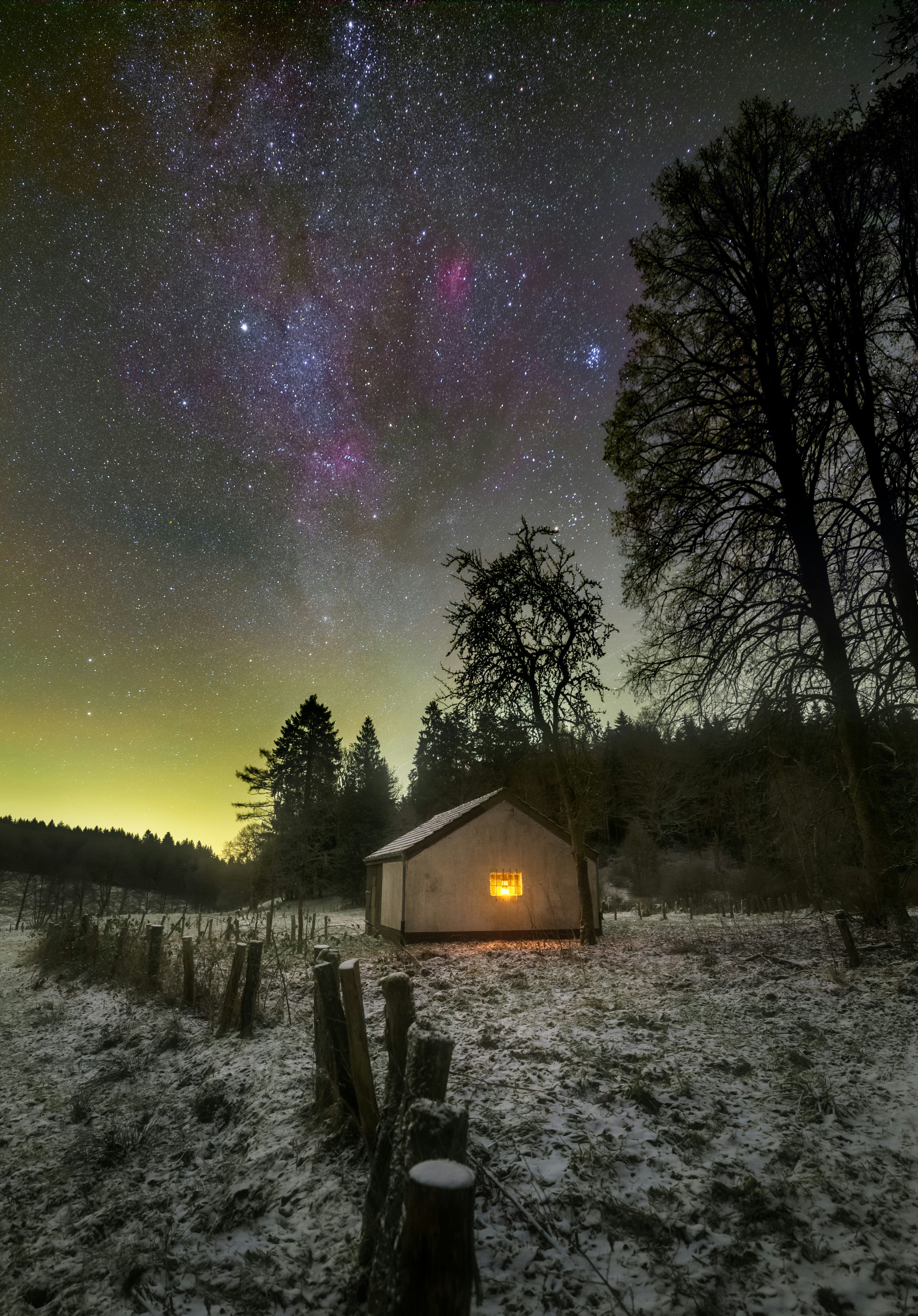 Starry Sky Over Snowy Cabin