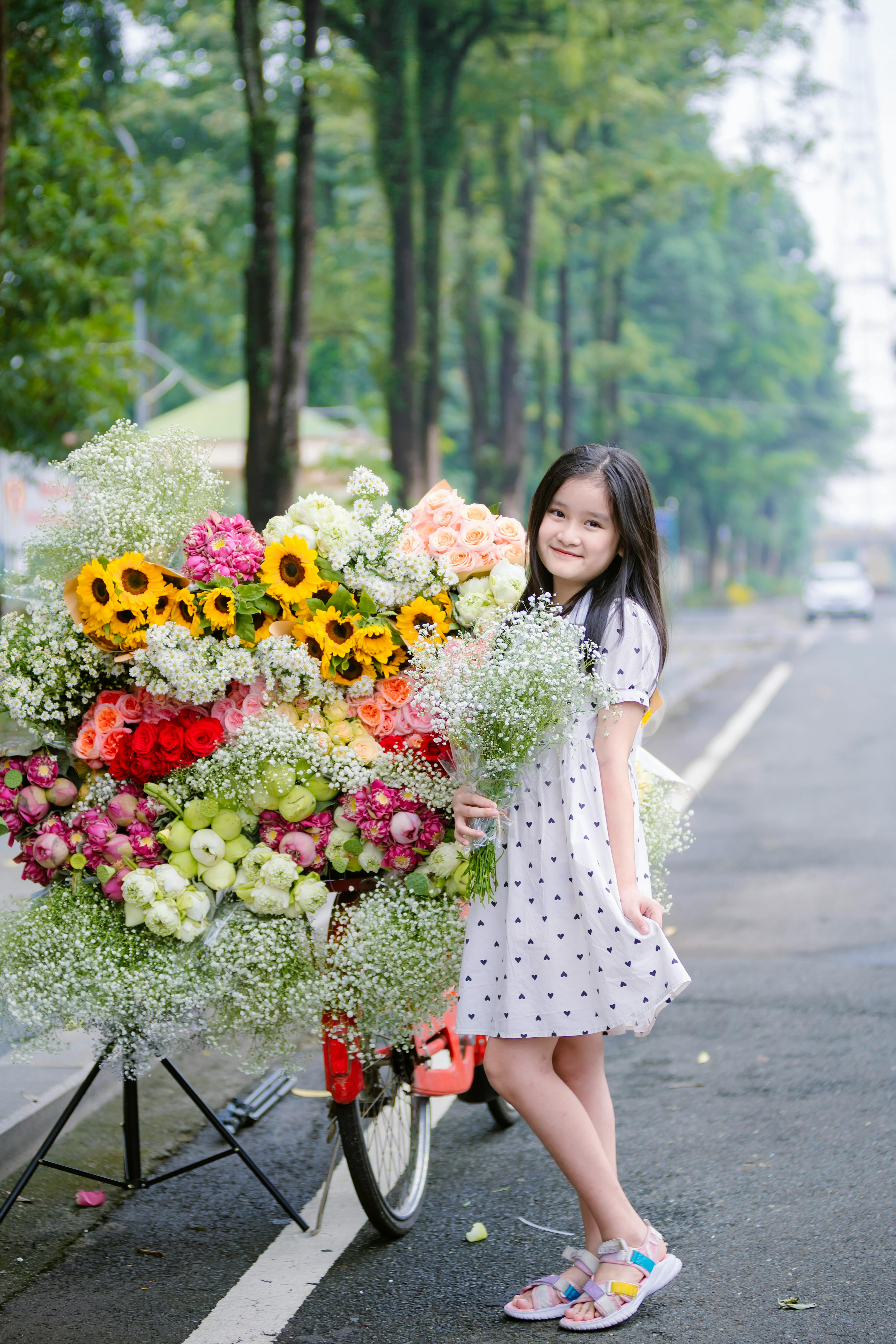 Young Girl With Colorful Flower Arrangements