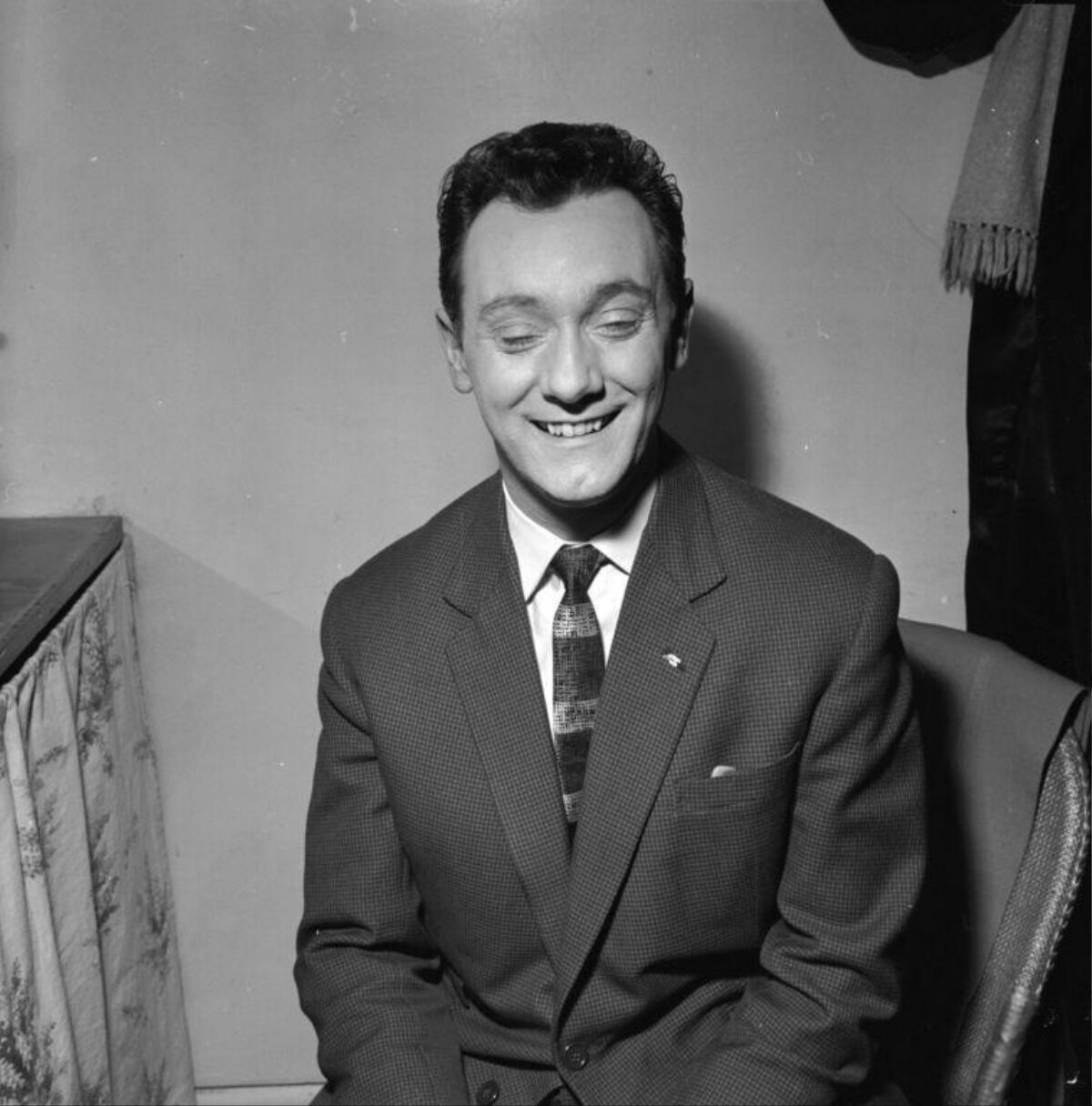 Seated Smiling Man in Vintage Suit