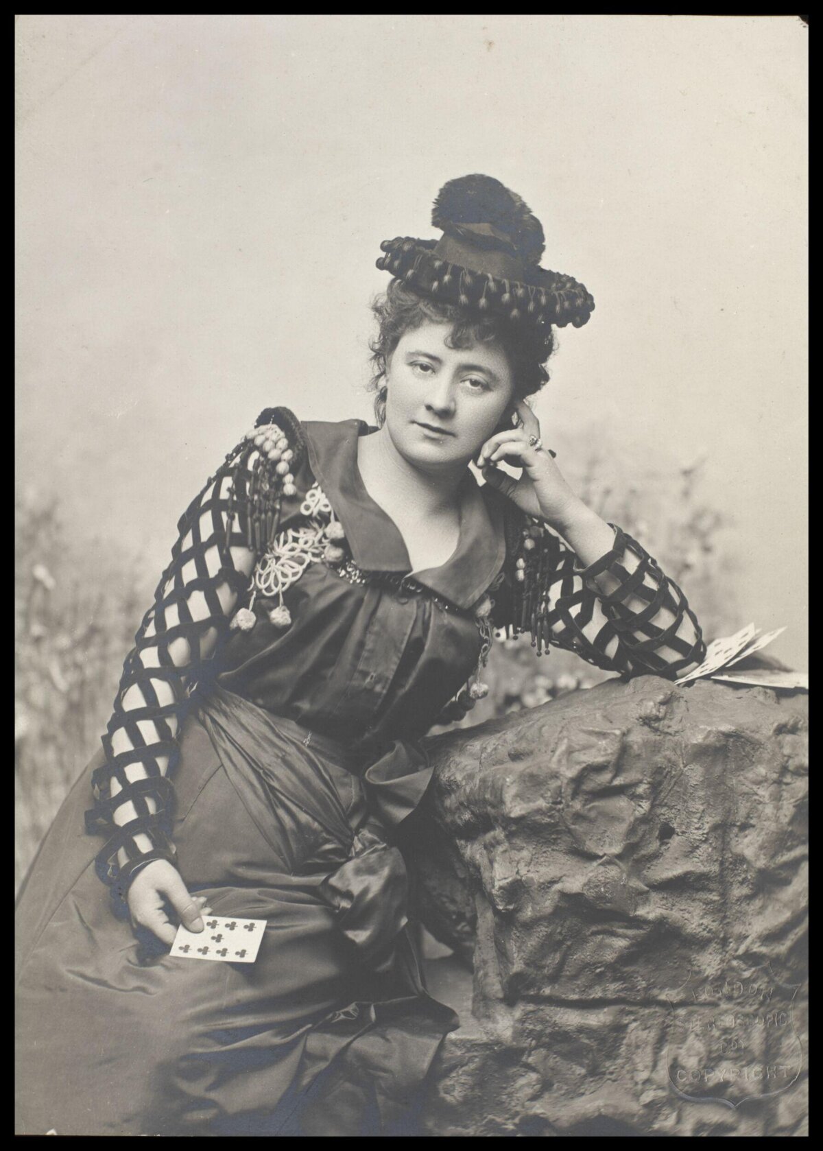 Portrait of Woman Holding Playing Cards