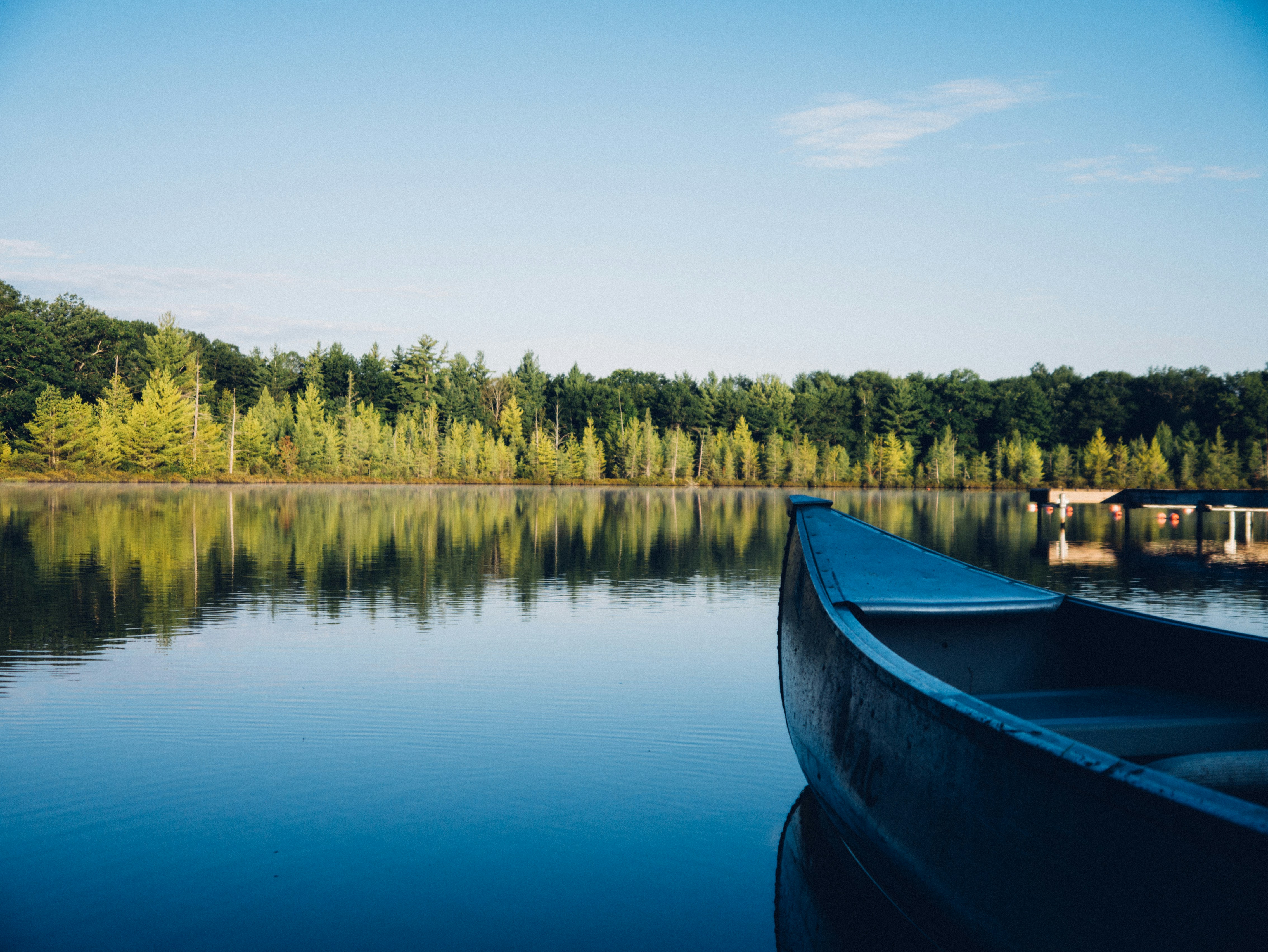 Canoe on Calm Forest Lake