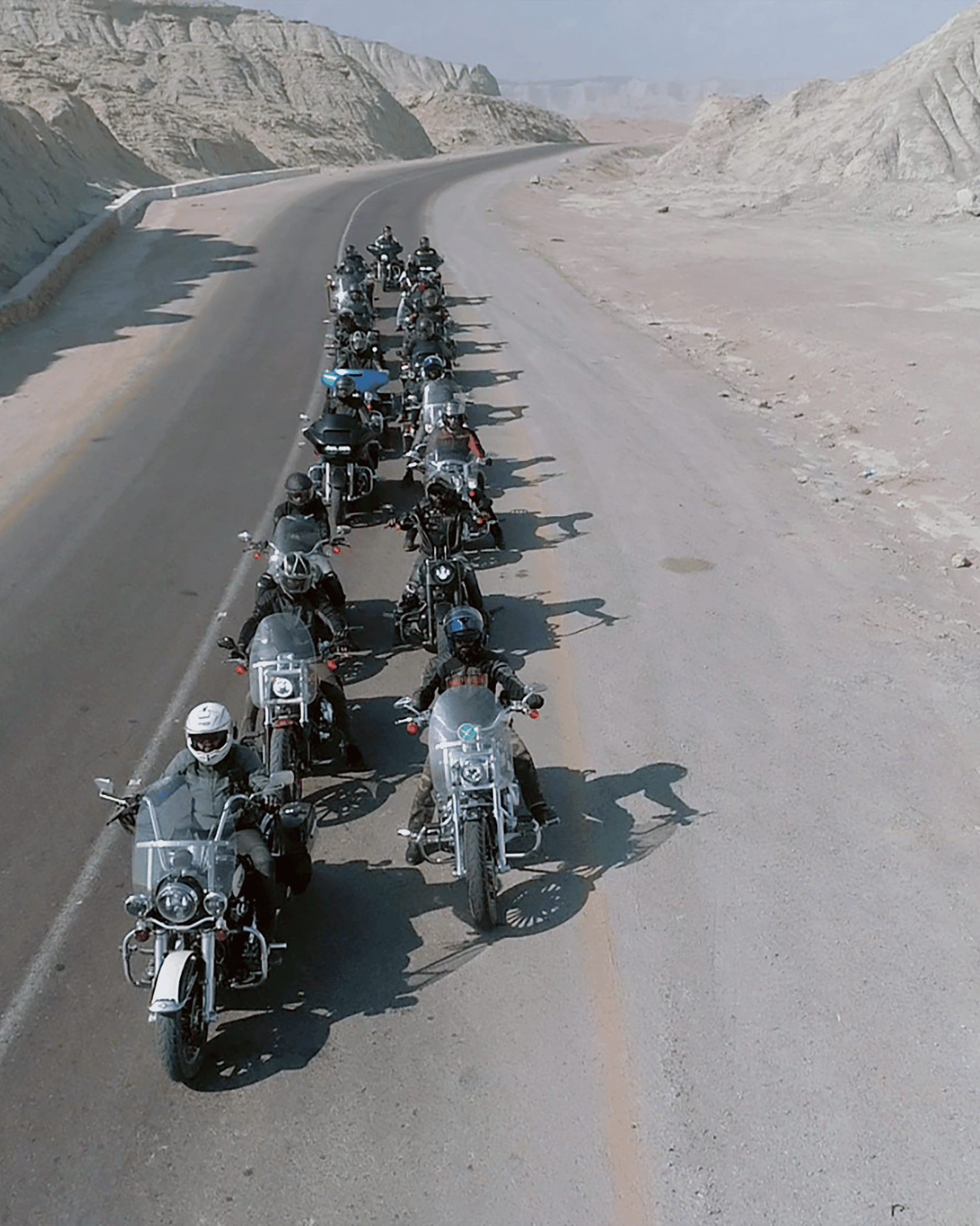 Motorcycle Group Riding on Desert Road