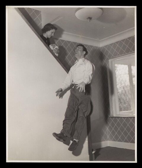 Floating Man at Indoor Staircase