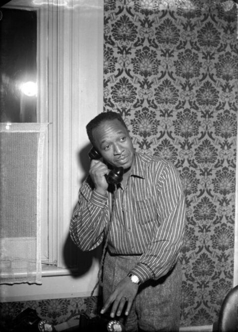 Black Man Talking on Vintage Telephone
