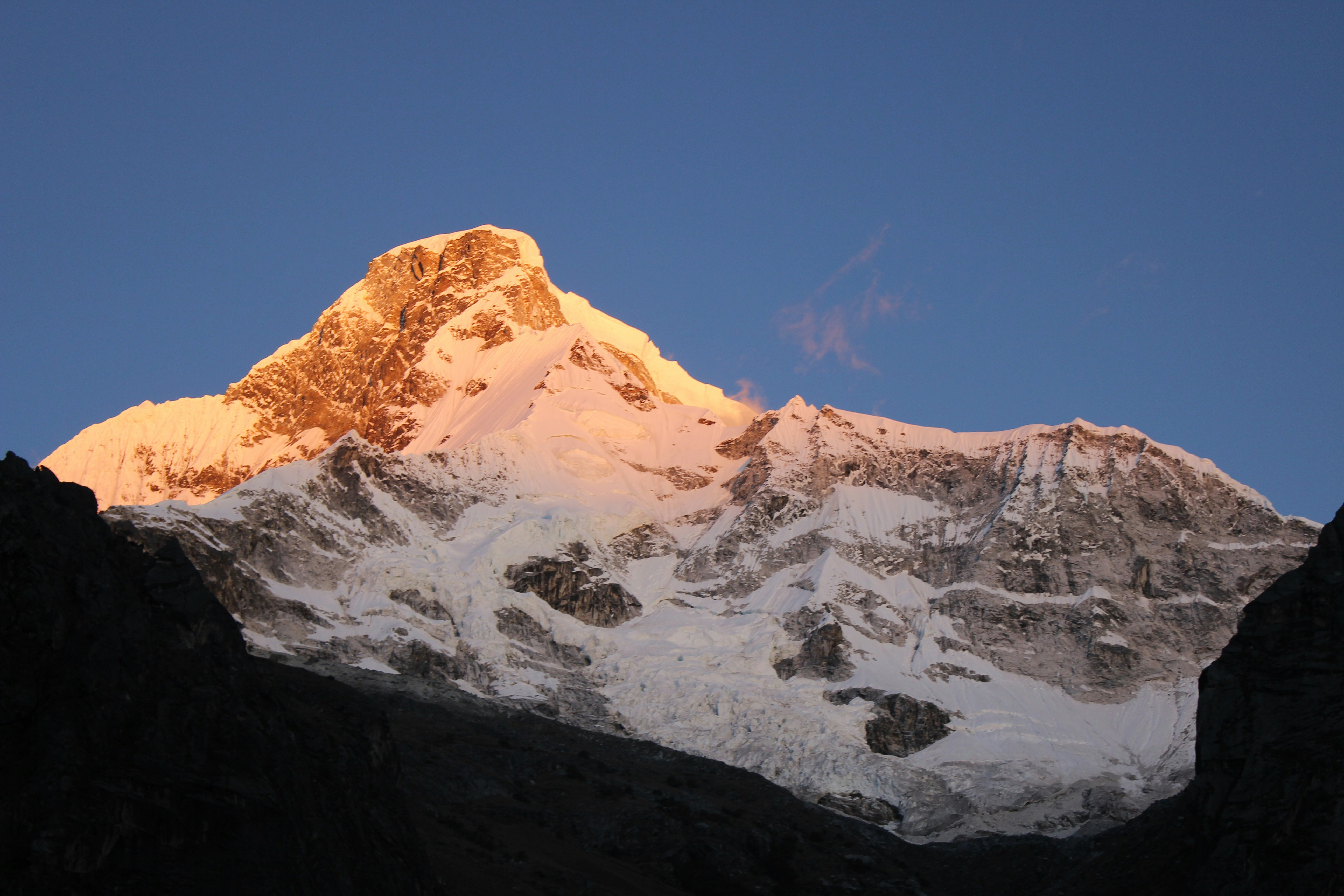 Golden Sunlit Snow Mountain Peak