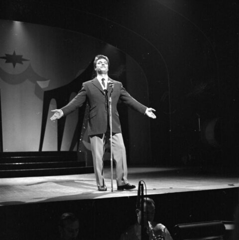 Male Singer Performing on Stage