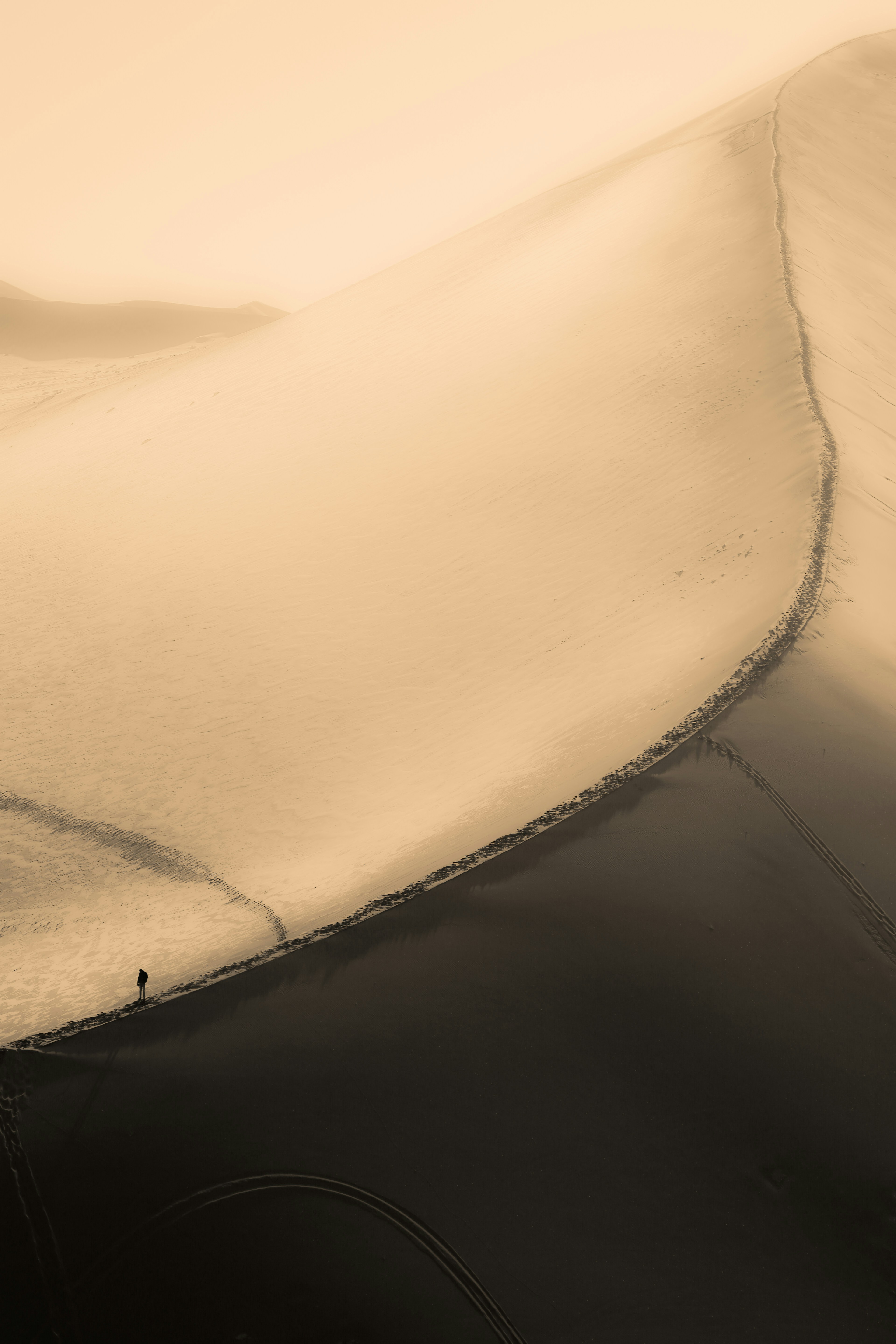 Lone Walker on Desert Sand Dunes