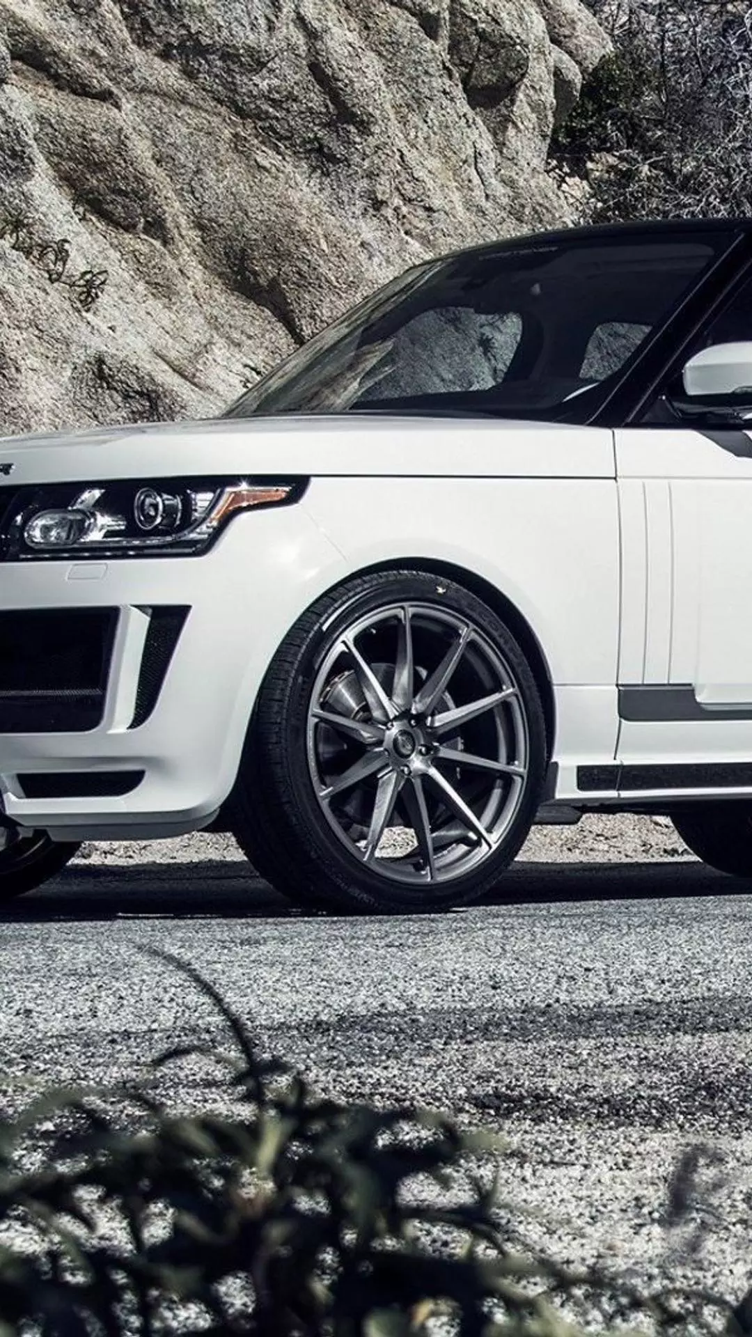 White Luxury SUV on Mountain Road