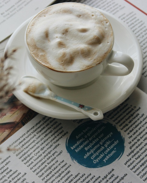 Cup of Cappuccino on Newspaper