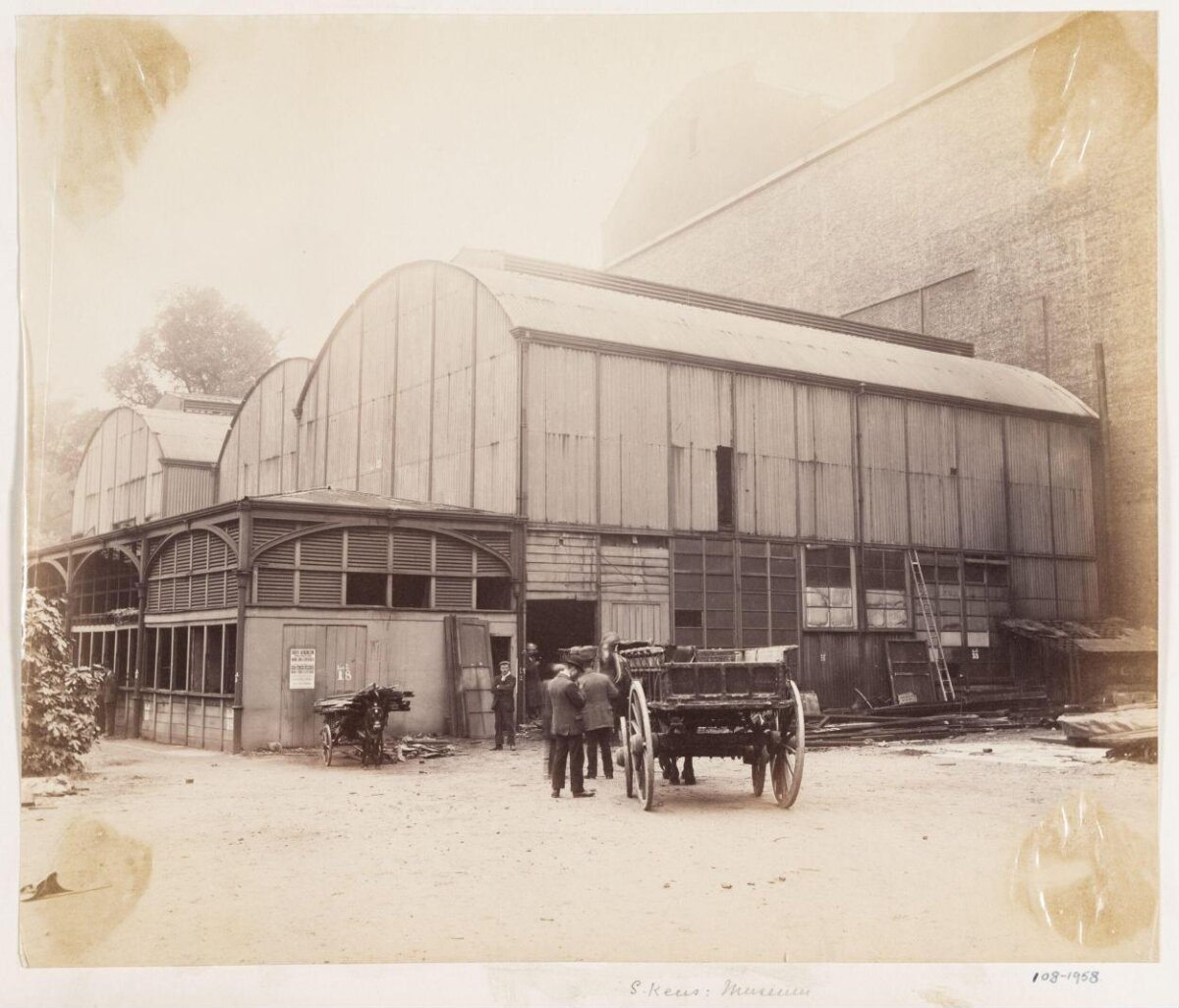 Vintage Industrial Yard with Horse-drawn Carts