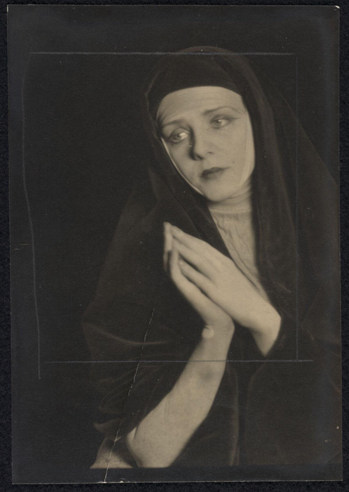 Vintage Portrait of Praying Woman in Veil