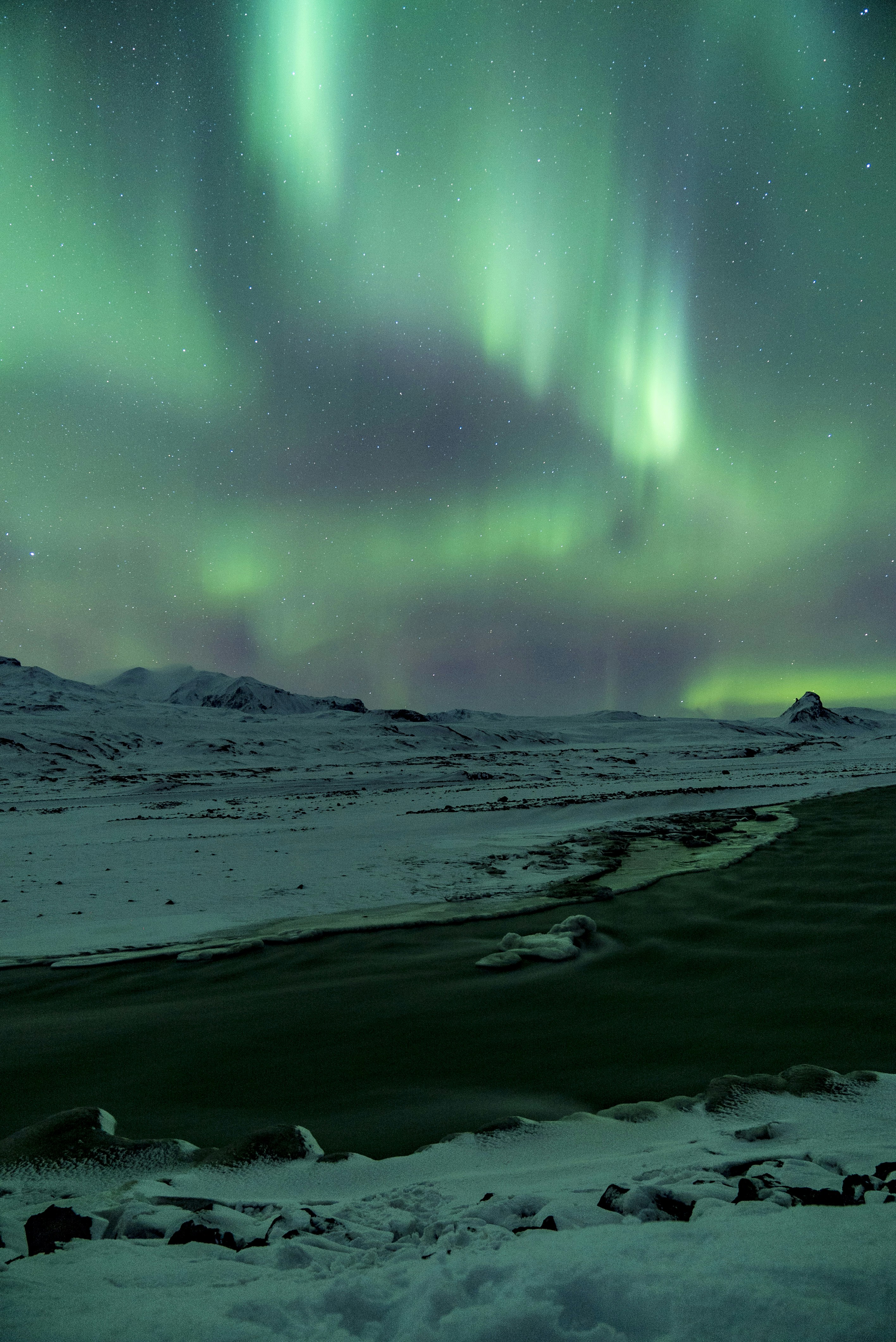 Aurora over Snowy Polar Landscape