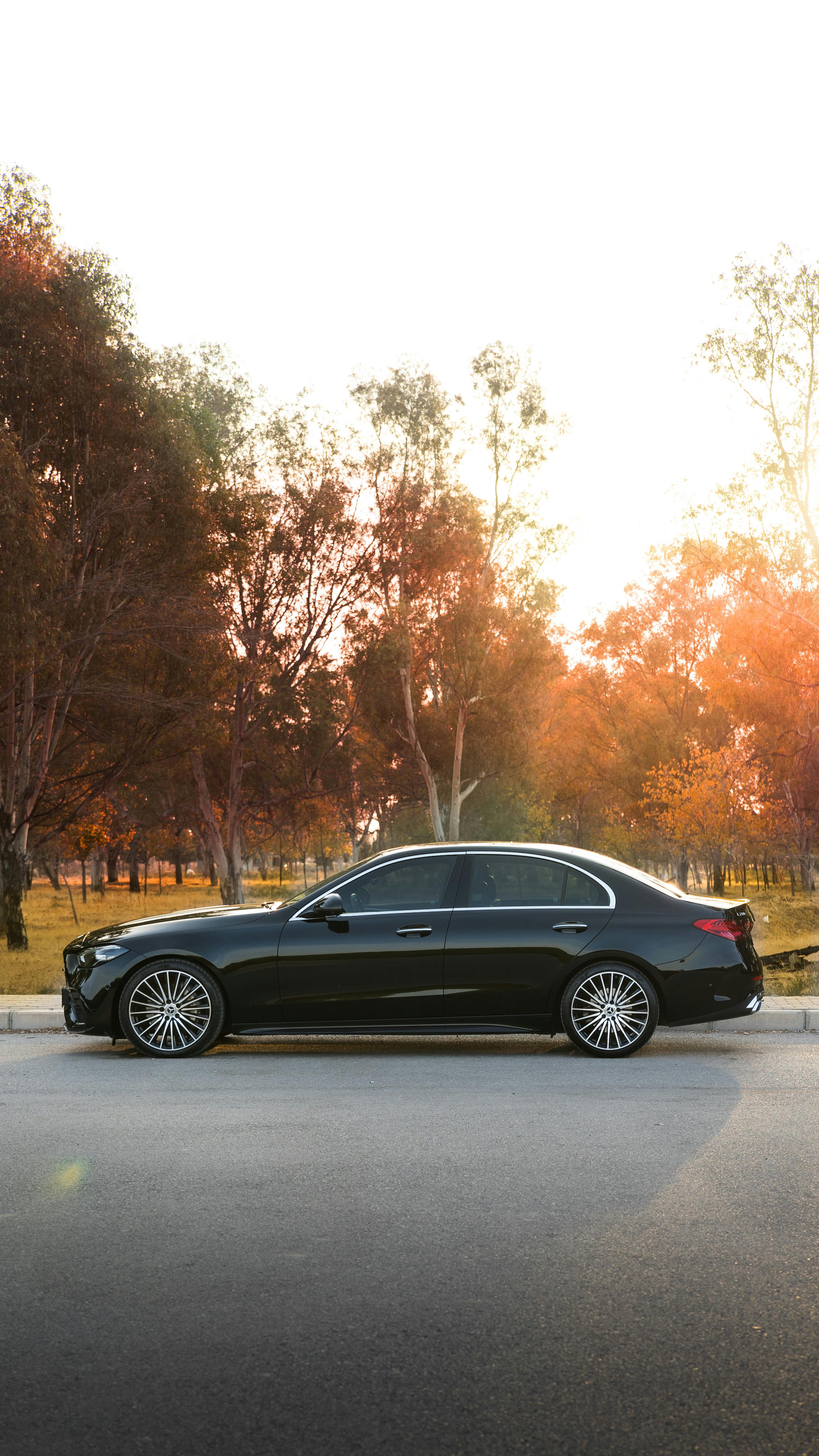 Black Sedan Parked at Sunset
