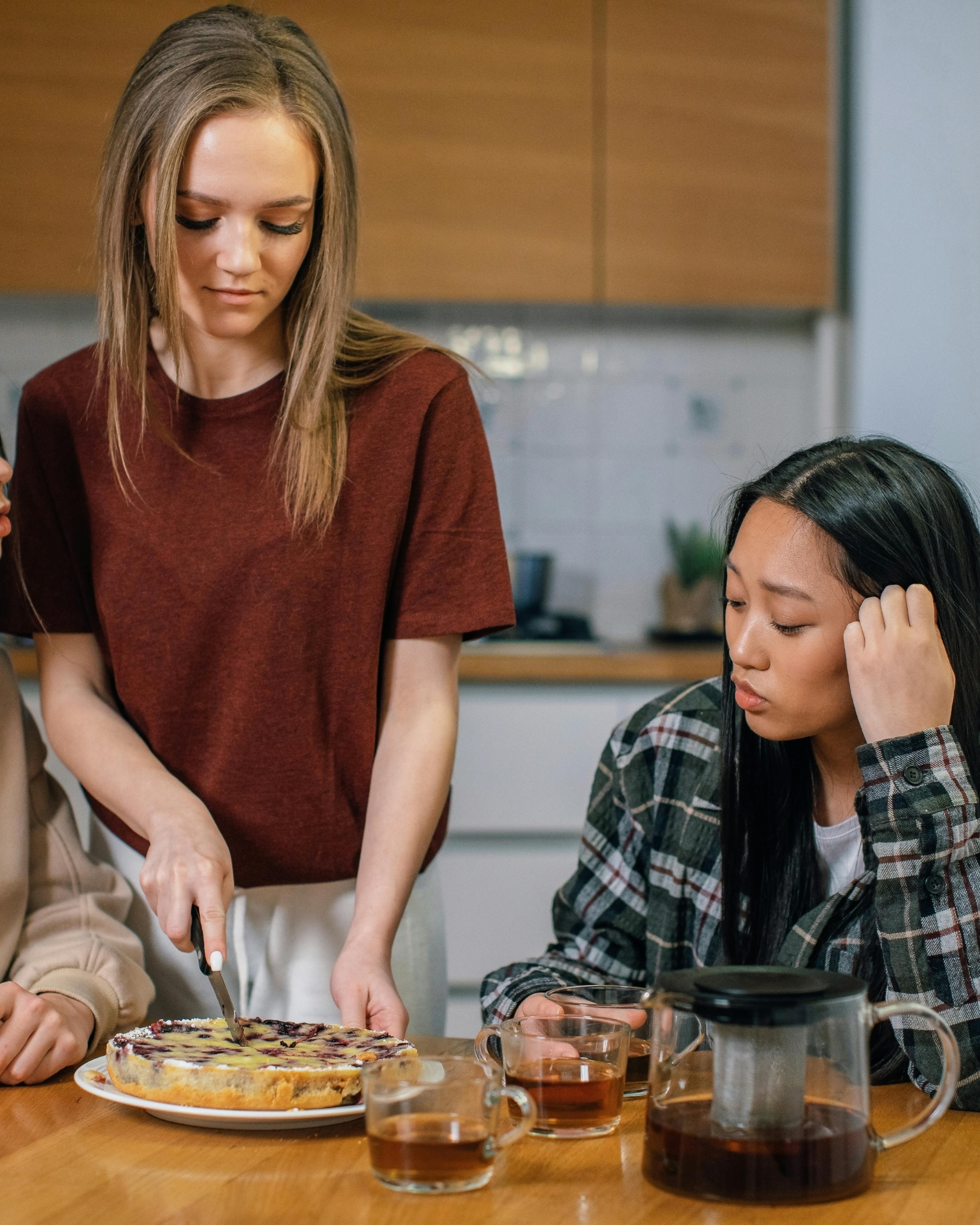 Young Women Sharing Homemade Cake