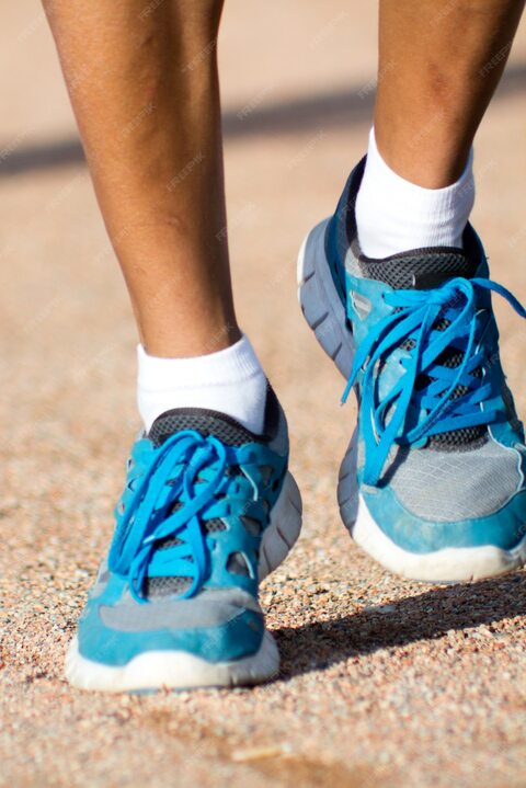 Runner's Blue Running Shoes on Path